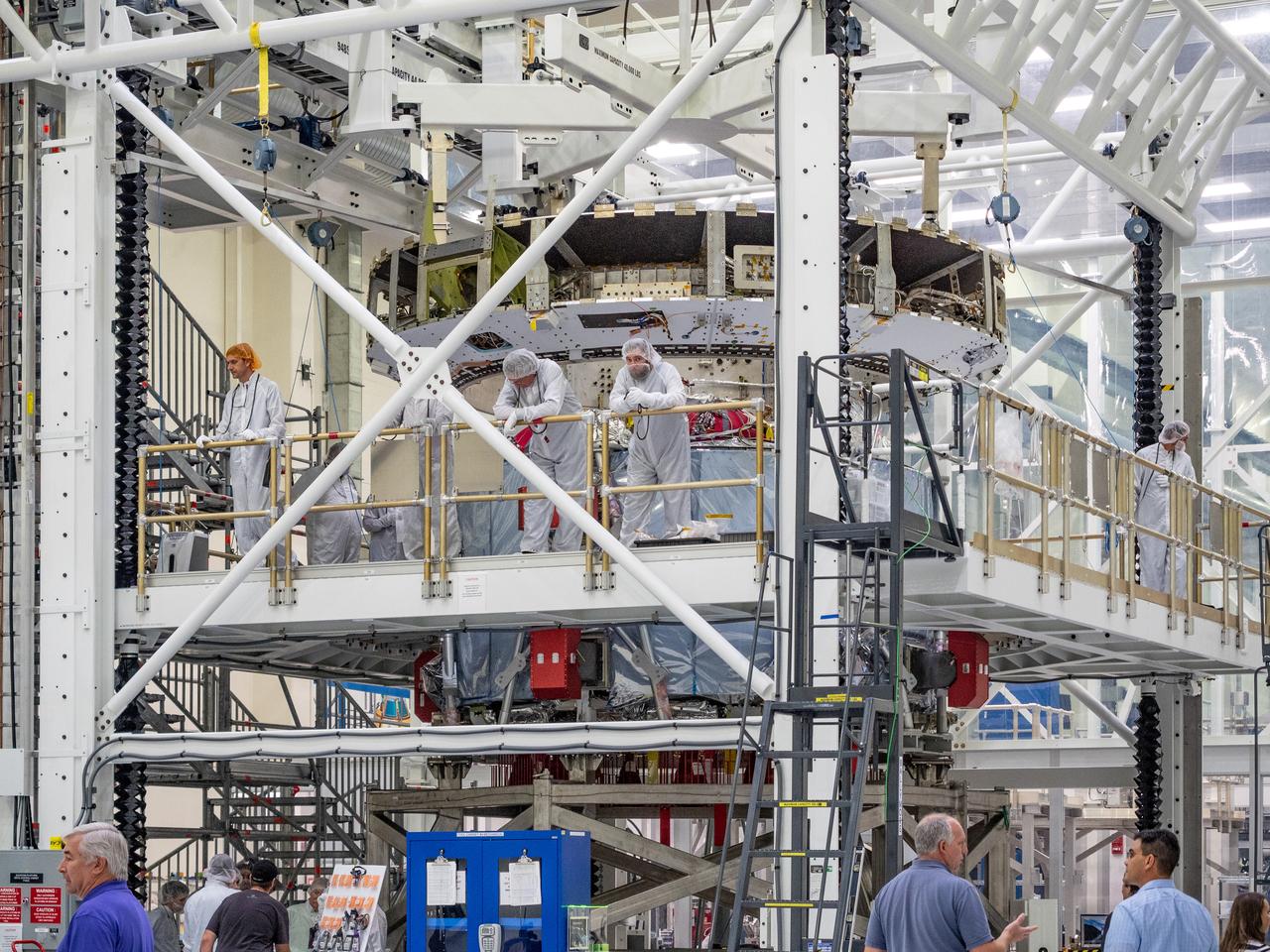 At the Operations and Checkout Building at Kennedy Space Center, Lockheed Martin technicians work to mate Orion's crew module adapter to the European Service Module on Nov. 13, 2018...For the first time, NASA will use a European-built system as a critical element to power an American spacecraft, extending the international cooperation of the International Space Station into deep space. The European Service Module is a unique collaboration across space agencies and industry including ESA’s prime contractor, Airbus, and 10 European countries. The completion of service module work in Europe and shipment to Kennedy signifies a major milestone toward NASA’s human deep space exploration missions to the Moon and beyond.