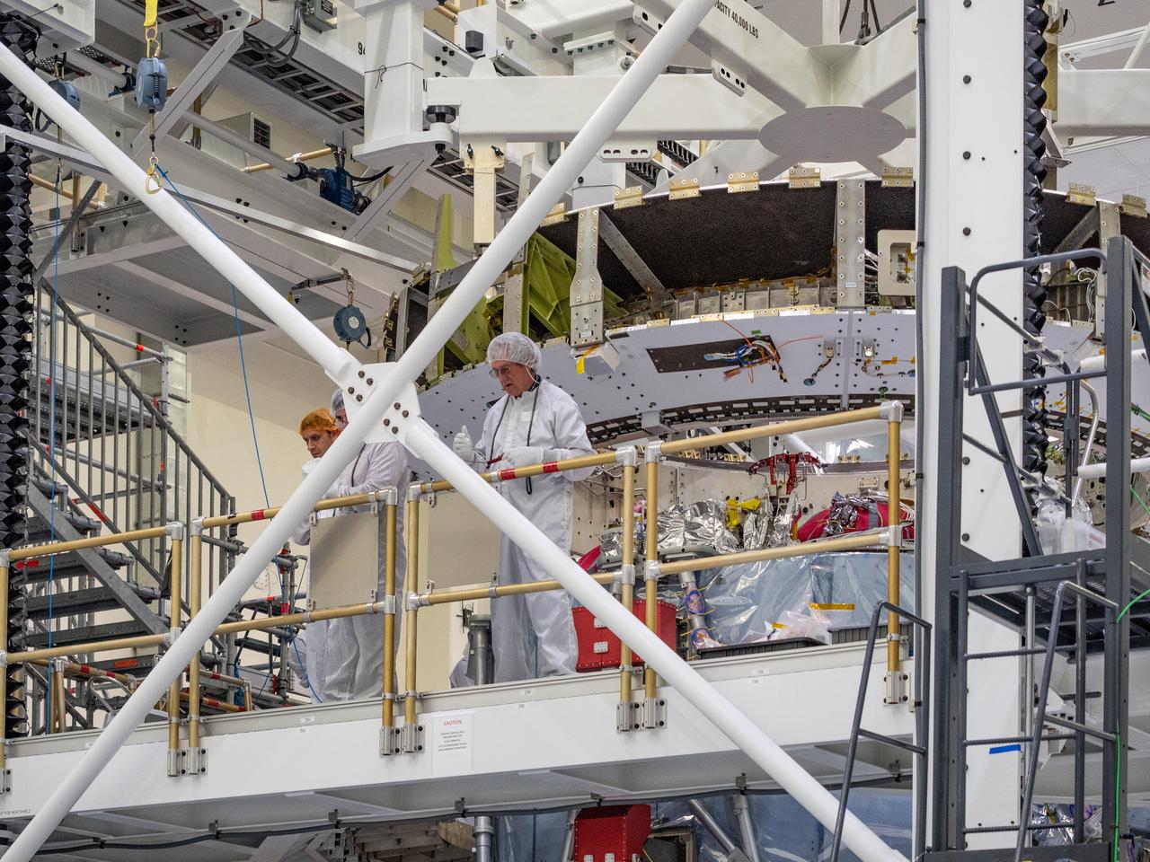At the Operations and Checkout Building at Kennedy Space Center, Lockheed Martin technicians work to mate Orion's crew module adapter to the European Service Module on Nov. 13, 2018...For the first time, NASA will use a European-built system as a critical element to power an American spacecraft, extending the international cooperation of the International Space Station into deep space. The European Service Module is a unique collaboration across space agencies and industry including ESA’s prime contractor, Airbus, and 10 European countries. The completion of service module work in Europe and shipment to Kennedy signifies a major milestone toward NASA’s human deep space exploration missions to the Moon and beyond.