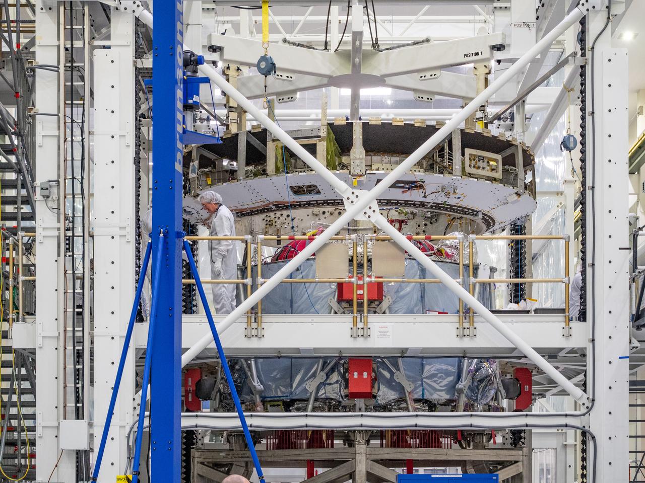 At the Operations and Checkout Building at Kennedy Space Center, Lockheed Martin technicians work to mate Orion's crew module adapter to the European Service Module on Nov. 13, 2018...For the first time, NASA will use a European-built system as a critical element to power an American spacecraft, extending the international cooperation of the International Space Station into deep space. The European Service Module is a unique collaboration across space agencies and industry including ESA’s prime contractor, Airbus, and 10 European countries. The completion of service module work in Europe and shipment to Kennedy signifies a major milestone toward NASA’s human deep space exploration missions to the Moon and beyond.