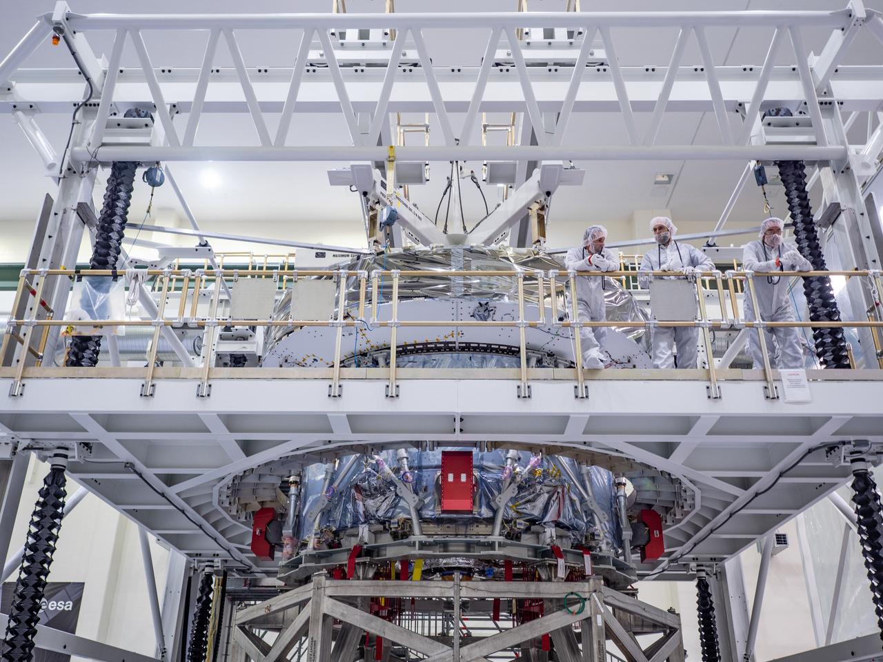 At the Operations and Checkout Building at Kennedy Space Center, Lockheed Martin technicians work to mate Orion's crew module adapter to the European Service Module on Nov. 14, 2018...For the first time, NASA will use a European-built system as a critical element to power an American spacecraft, extending the international cooperation of the International Space Station into deep space. The European Service Module is a unique collaboration across space agencies and industry including ESA’s prime contractor, Airbus, and 10 European countries. The completion of service module work in Europe and shipment to Kennedy signifies a major milestone toward NASA’s human deep space exploration missions to the Moon and beyond.