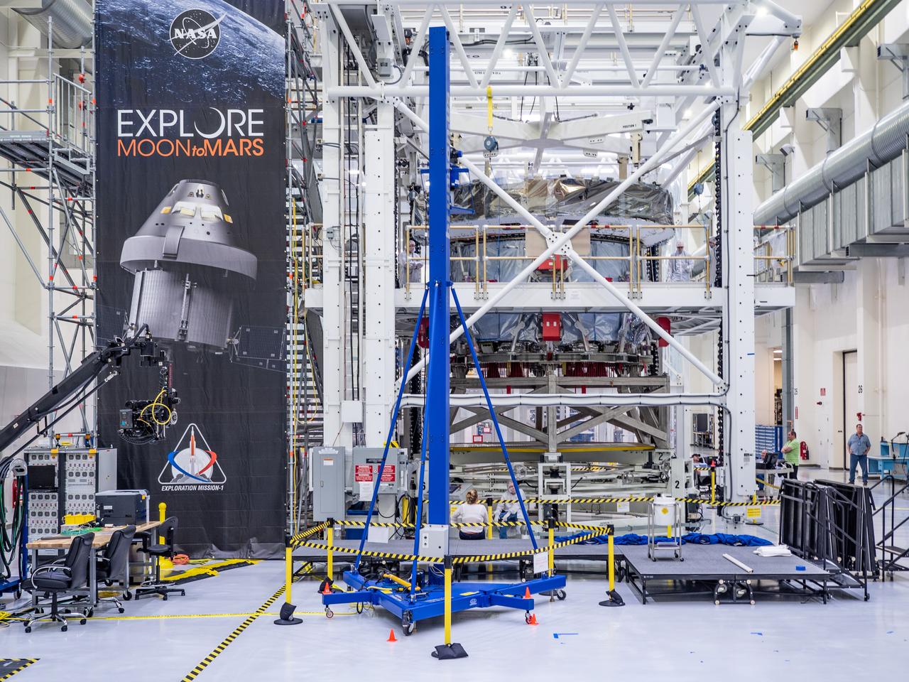 At the Operations and Checkout Building at Kennedy Space Center, Lockheed Martin technicians work to mate Orion's crew module adapter to the European Service Module on Nov. 14, 2018...For the first time, NASA will use a European-built system as a critical element to power an American spacecraft, extending the international cooperation of the International Space Station into deep space. The European Service Module is a unique collaboration across space agencies and industry including ESA’s prime contractor, Airbus, and 10 European countries. The completion of service module work in Europe and shipment to Kennedy signifies a major milestone toward NASA’s human deep space exploration missions to the Moon and beyond.