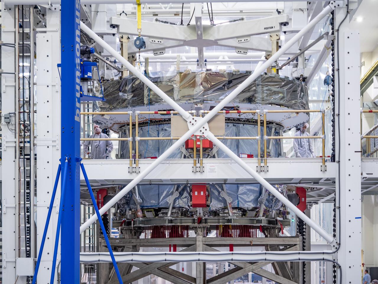 At the Operations and Checkout Building at Kennedy Space Center, Lockheed Martin technicians work to mate Orion's crew module adapter to the European Service Module on Nov. 14, 2018...For the first time, NASA will use a European-built system as a critical element to power an American spacecraft, extending the international cooperation of the International Space Station into deep space. The European Service Module is a unique collaboration across space agencies and industry including ESA’s prime contractor, Airbus, and 10 European countries. The completion of service module work in Europe and shipment to Kennedy signifies a major milestone toward NASA’s human deep space exploration missions to the Moon and beyond.