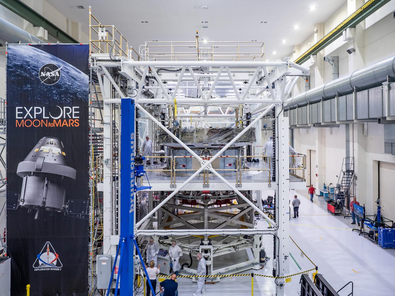 At the Operations and Checkout Building at Kennedy Space Center, Lockheed Martin technicians work to mate Orion's crew module adapter to the European Service Module on Nov. 14, 2018...For the first time, NASA will use a European-built system as a critical element to power an American spacecraft, extending the international cooperation of the International Space Station into deep space. The European Service Module is a unique collaboration across space agencies and industry including ESA’s prime contractor, Airbus, and 10 European countries. The completion of service module work in Europe and shipment to Kennedy signifies a major milestone toward NASA’s human deep space exploration missions to the Moon and beyond.