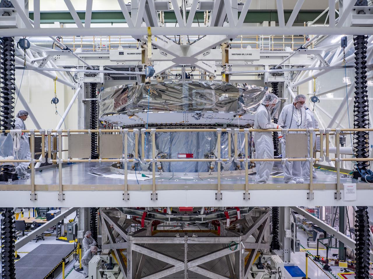 At the Operations and Checkout Building at Kennedy Space Center, Lockheed Martin technicians work to mate Orion's crew module adapter to the European Service Module on Nov. 14, 2018...For the first time, NASA will use a European-built system as a critical element to power an American spacecraft, extending the international cooperation of the International Space Station into deep space. The European Service Module is a unique collaboration across space agencies and industry including ESA’s prime contractor, Airbus, and 10 European countries. The completion of service module work in Europe and shipment to Kennedy signifies a major milestone toward NASA’s human deep space exploration missions to the Moon and beyond.