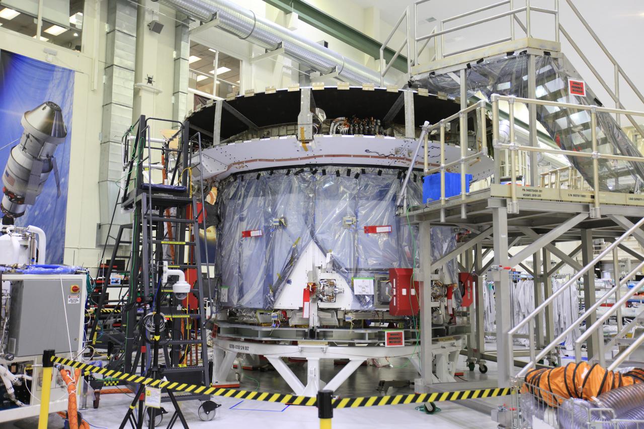 The crew and service module for Artemis I continue preparations for mating inside the Operations and Checkout (O&C) Building High Bay at Kennedy Space Center on March 21, 2019. Alongside, the pressure vessel for Artemis II is undergoing install of its secondary structure.
