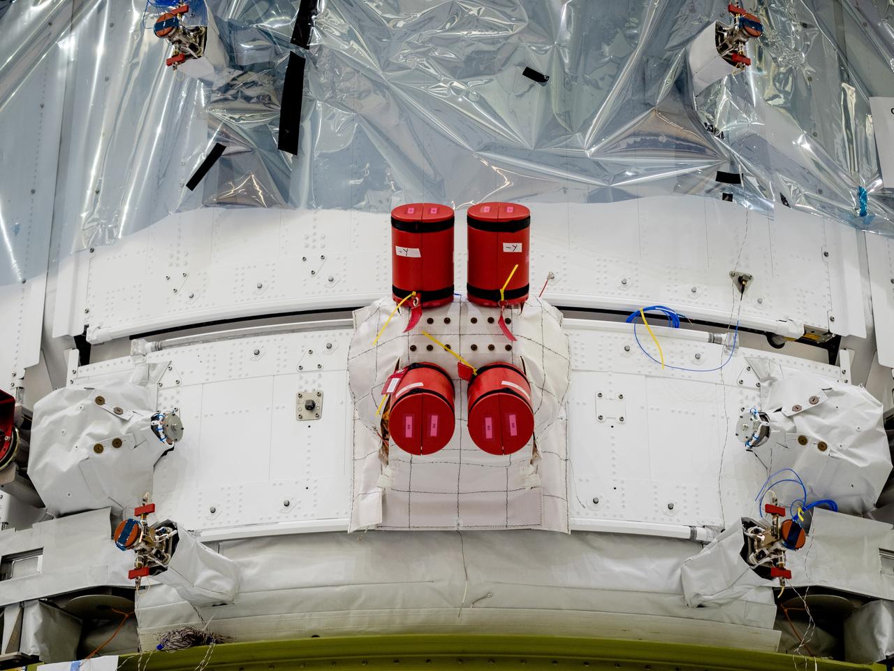 On April 29, Orion’s Service Module, shown here on May 3, 2019, moved to the lift station inside the assembly bay for installation and fastening of systems in preparation for Direct Field Acoustics Test (DFAT). The Service Module will move down to the east end of the bay next week where it will be surrounded with speakers and exposed to the acoustic level that will be experienced in space.