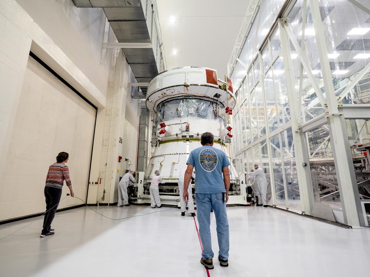 On April 29, Orion’s Service Module, shown here on May 3, 2019, moved to the lift station inside the assembly bay for installation and fastening of systems in preparation for Direct Field Acoustics Test (DFAT). The Service Module will move down to the east end of the bay next week where it will be surrounded with speakers and exposed to the acoustic level that will be experienced in space.