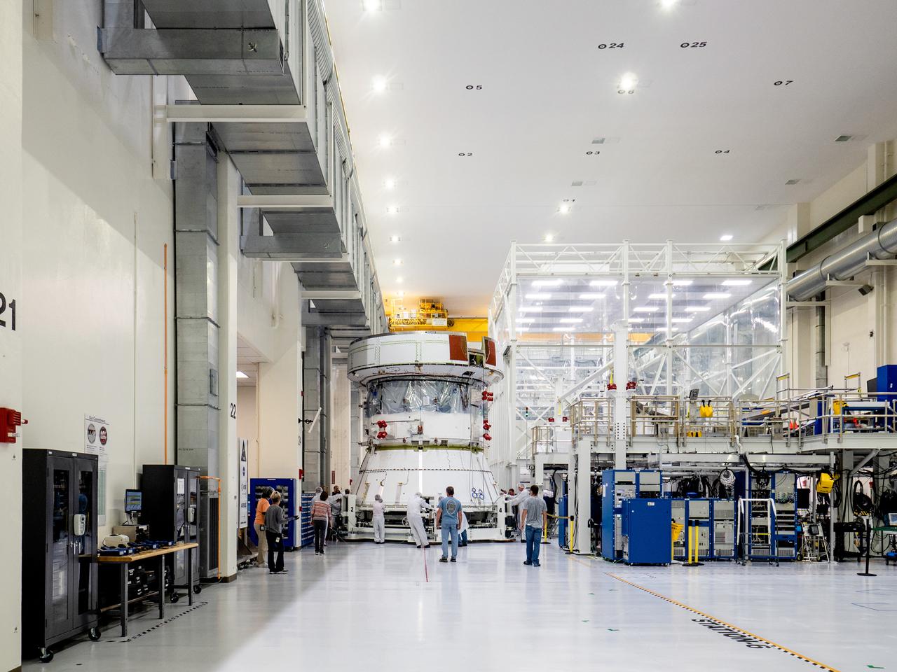 On April 29, Orion’s Service Module, shown here on May 3, 2019, moved to the lift station inside the assembly bay for installation and fastening of systems in preparation for Direct Field Acoustics Test (DFAT). The Service Module will move down to the east end of the bay next week where it will be surrounded with speakers and exposed to the acoustic level that will be experienced in space.