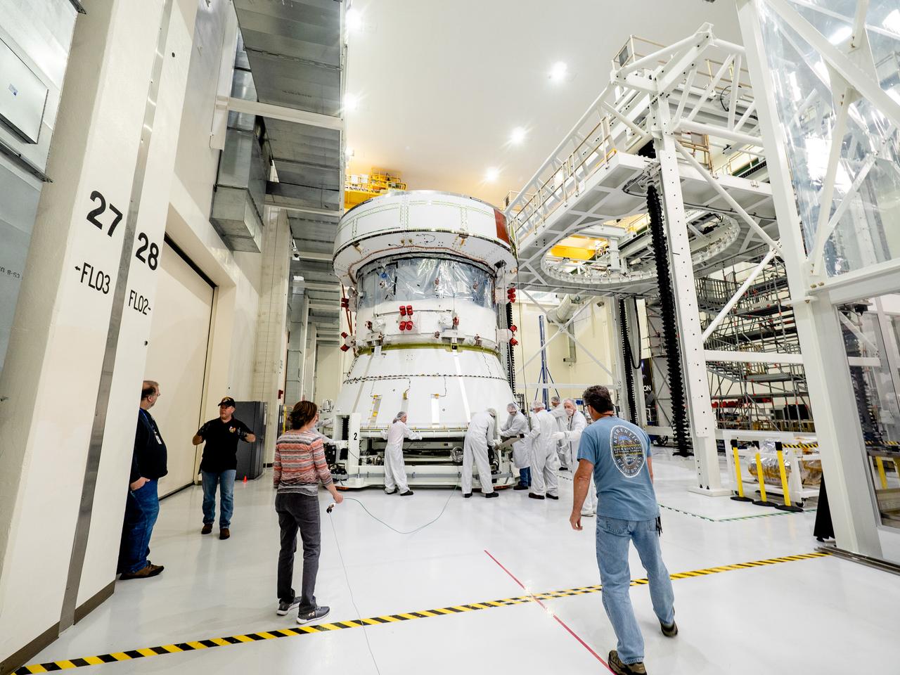 On April 29, Orion’s Service Module, shown here on May 3, 2019, moved to the lift station inside the assembly bay for installation and fastening of systems in preparation for Direct Field Acoustics Test (DFAT). The Service Module will move down to the east end of the bay next week where it will be surrounded with speakers and exposed to the acoustic level that will be experienced in space.