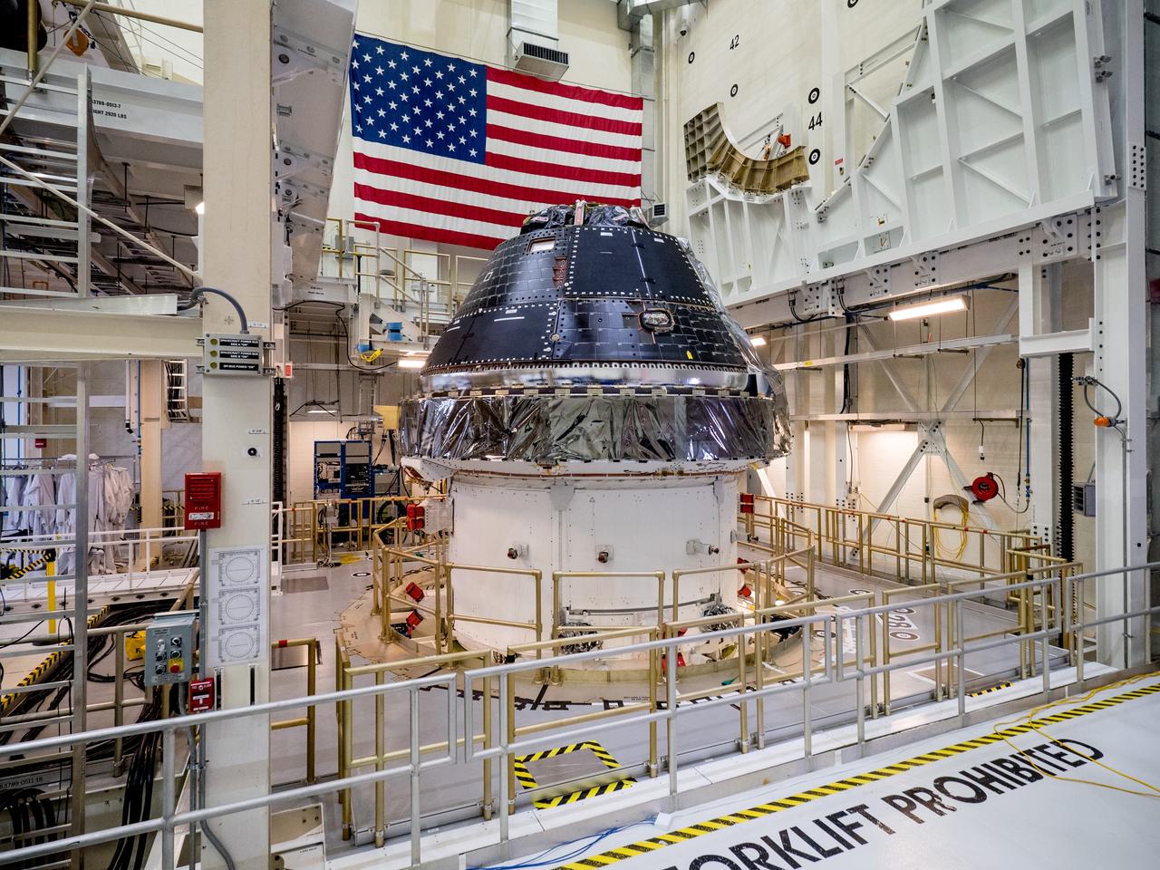 Vice President Mike Pence visited and gave remarks in the Neil Armstrong Operations and Checkout Building at NASA’s Kennedy Space Center in Florida on July 20, 2019 to commemorate the 50th anniversary of the agency’s Apollo 11 Moon landing and announce to America the completion of NASA’s Orion crew capsule, shown here on July 19, 2019, for the first Artemis lunar mission.
