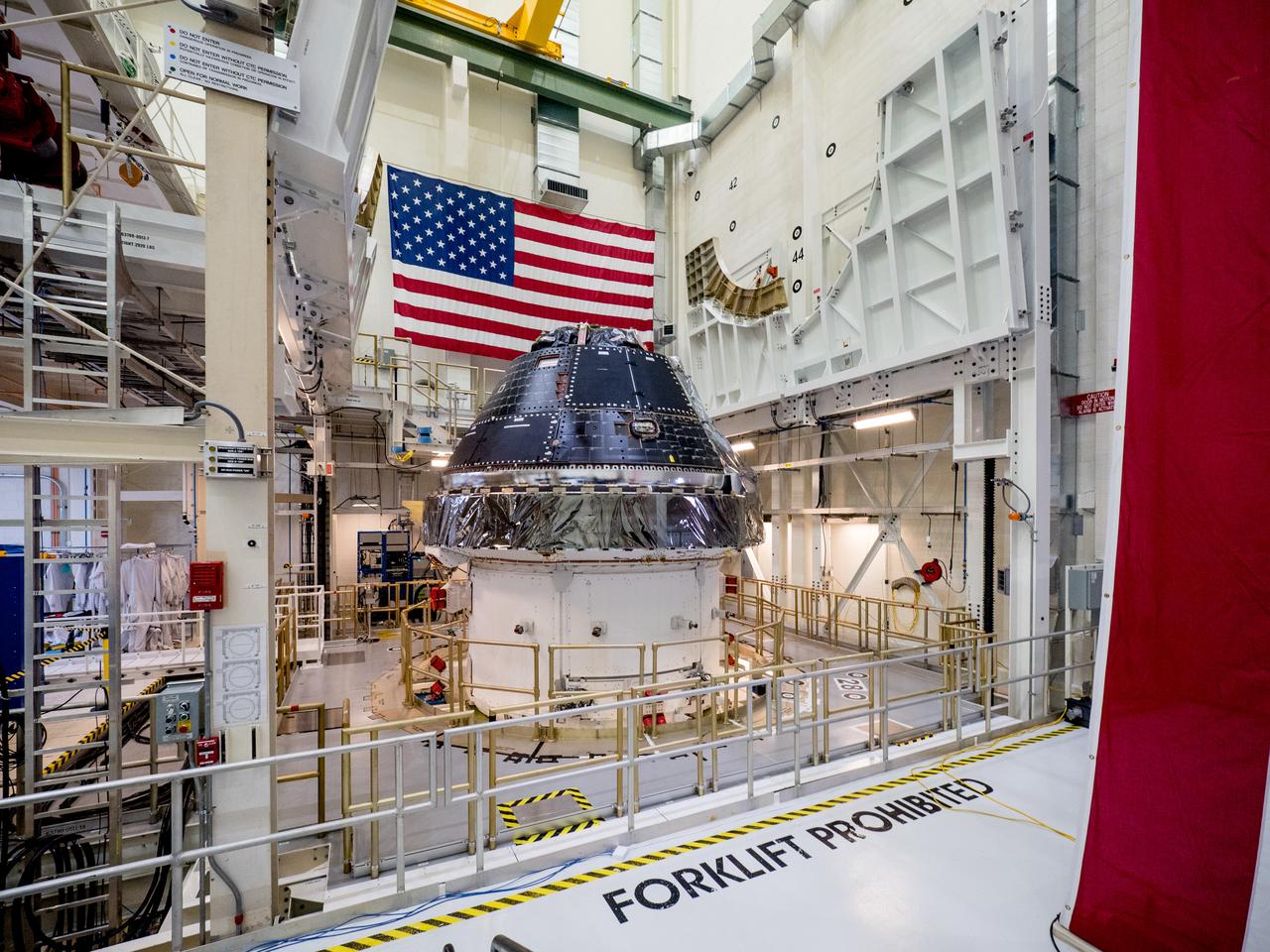 Vice President Mike Pence visited and gave remarks in the Neil Armstrong Operations and Checkout Building at NASA’s Kennedy Space Center in Florida on July 20, 2019 to commemorate the 50th anniversary of the agency’s Apollo 11 Moon landing and announce to America the completion of NASA’s Orion crew capsule, shown here on July 19, 2019, for the first Artemis lunar mission.