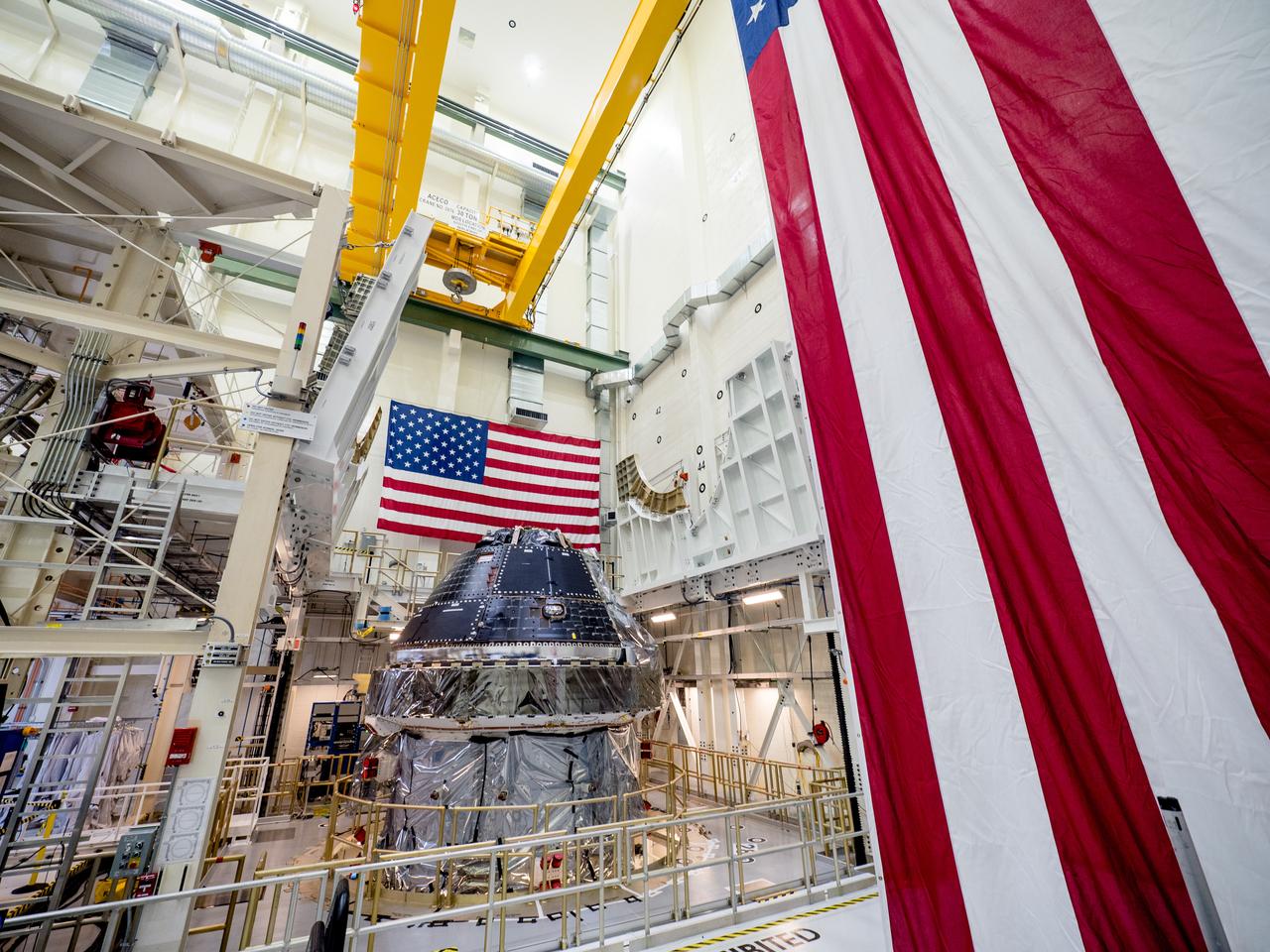 Vice President Mike Pence visited and gave remarks in the Neil Armstrong Operations and Checkout Building at NASA’s Kennedy Space Center in Florida on July 20, 2019 to commemorate the 50th anniversary of the agency’s Apollo 11 Moon landing and announce to America the completion of NASA’s Orion crew capsule, shown here on July 19, 2019, for the first Artemis lunar mission.