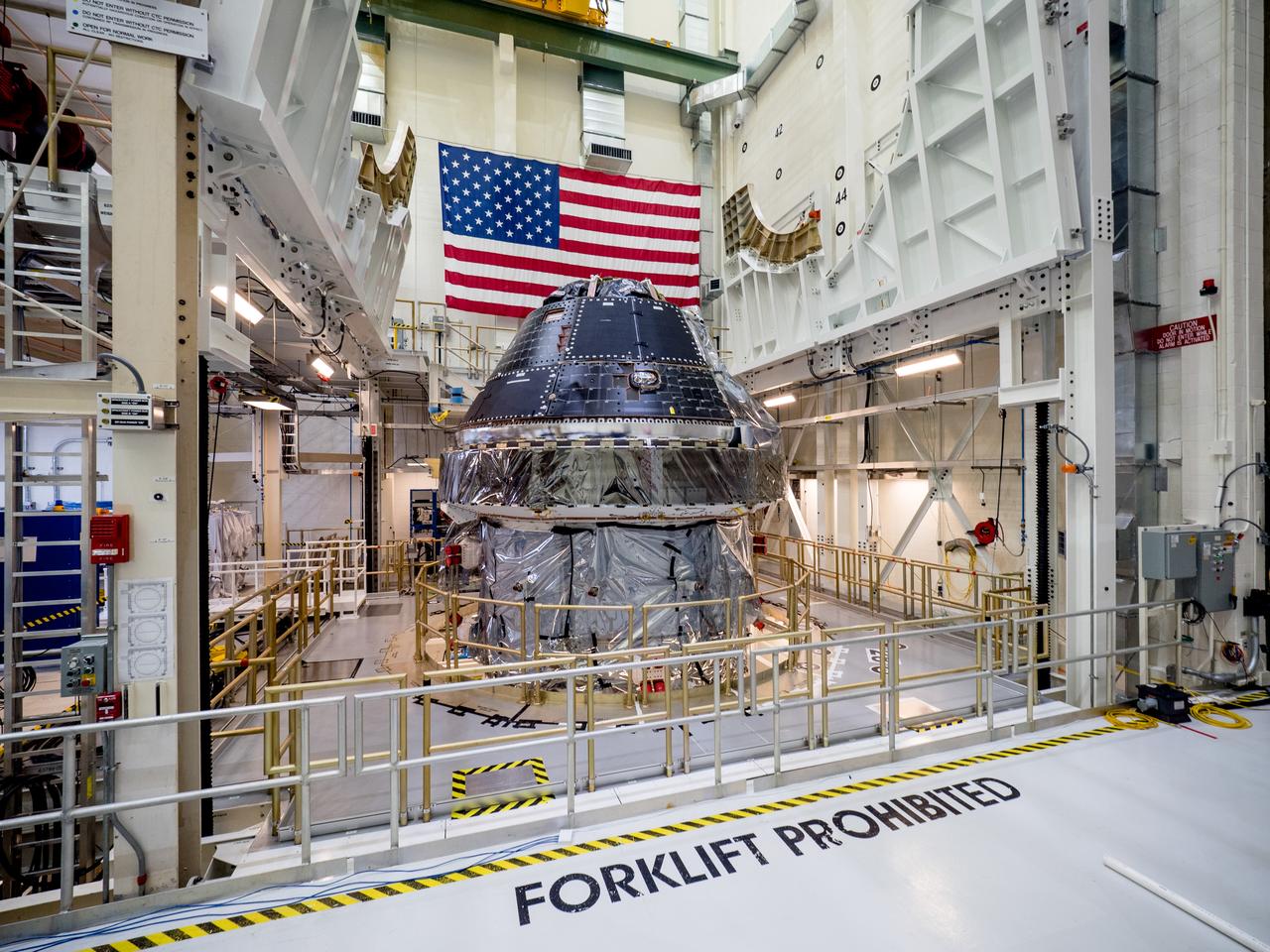 Vice President Mike Pence visited and gave remarks in the Neil Armstrong Operations and Checkout Building at NASA’s Kennedy Space Center in Florida on July 20, 2019 to commemorate the 50th anniversary of the agency’s Apollo 11 Moon landing and announce to America the completion of NASA’s Orion crew capsule, shown here on July 19, 2019, for the first Artemis lunar mission.