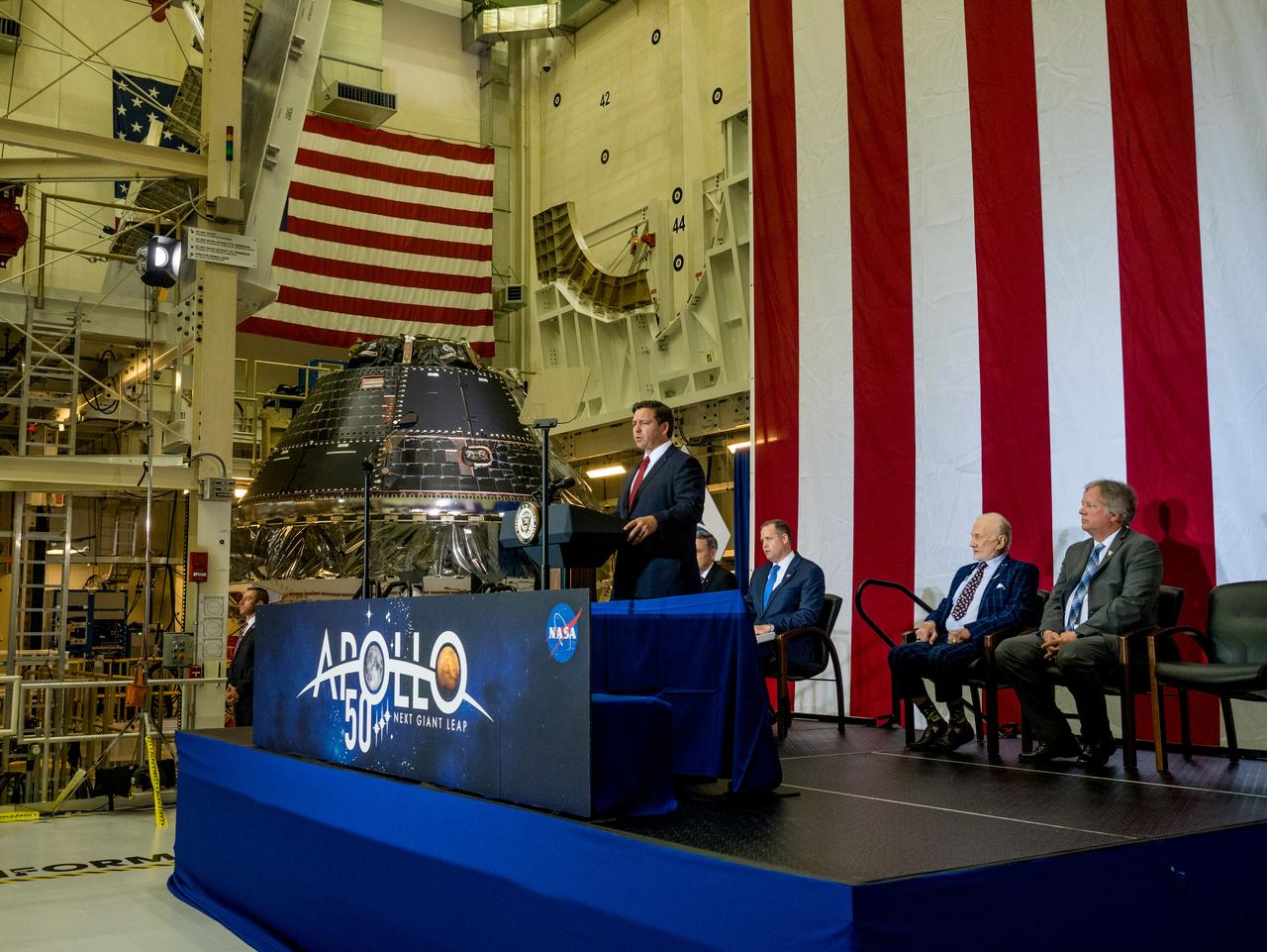 Vice President Mike Pence visited and gave remarks in the Neil Armstrong Operations and Checkout Building at NASA’s Kennedy Space Center in Florida on July 20, 2019 to commemorate the 50th anniversary of the agency’s Apollo 11 Moon landing and announce to America the completion of NASA’s Orion crew capsule, shown here on July 19, 2019, for the first Artemis lunar mission.