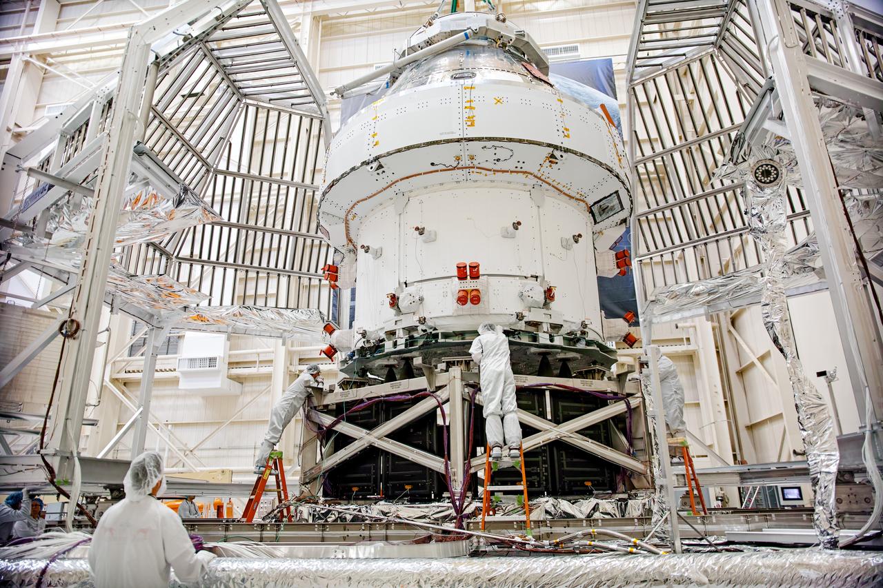 NASA’s Orion spacecraft–the crew module and European-built service module—is being lifted on Dec. 1, 2019 into a thermal cage and readied for its move into the vacuum chamber at NASA’s Neil A. Armstrong Test Facility in Ohio (formerly Plum Brook Station) for testing. Testing begins with a 60-day thermal test, where the spacecraft will be subjected to temperatures ranging from -250 to 300-degrees Fahrenheit to ensure it can withstand the harsh environment of space during Artemis missions. These extreme temperatures simulate flying in-and-out of sunlight and shadow in space using Heat Flux, a specially-designed system that heats specific parts of the spacecraft at any given time. Orion will also be surrounded on all sides by a set of large panels, called a cryogenic-shroud, that will provide the cold background temperatures of space.