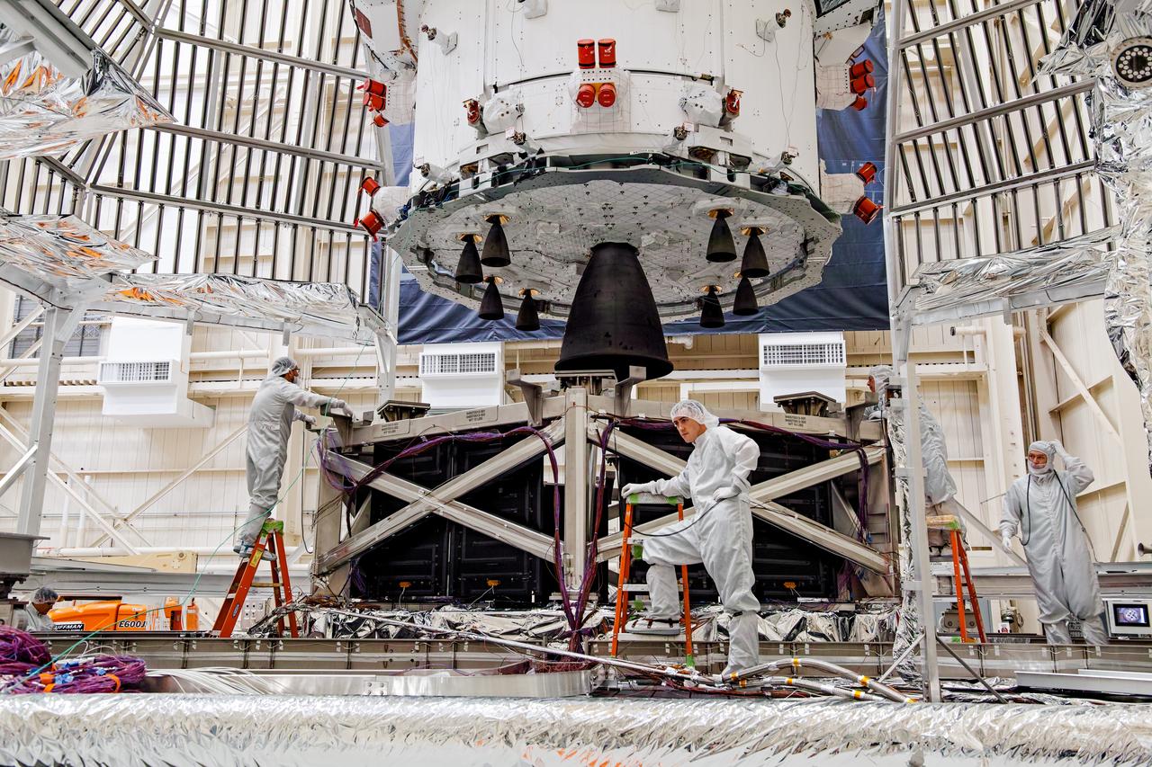 NASA’s Orion spacecraft–the crew module and European-built service module—is being lifted on Dec. 1, 2019 into a thermal cage and readied for its move into the vacuum chamber at NASA’s Neil A. Armstrong Test Facility in Ohio (formerly Plum Brook Station) for testing. Testing begins with a 60-day thermal test, where the spacecraft will be subjected to temperatures ranging from -250 to 300-degrees Fahrenheit to ensure it can withstand the harsh environment of space during Artemis missions. These extreme temperatures simulate flying in-and-out of sunlight and shadow in space using Heat Flux, a specially-designed system that heats specific parts of the spacecraft at any given time. Orion will also be surrounded on all sides by a set of large panels, called a cryogenic-shroud, that will provide the cold background temperatures of space.