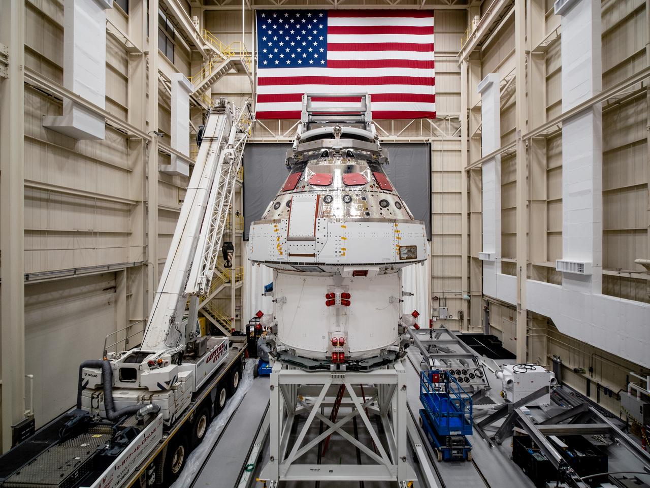 NASA’s Orion spacecraft–the crew module and European-built service module—is being lifted on Dec. 1, 2019 into a thermal cage and readied for its move into the vacuum chamber at NASA’s Neil A. Armstrong Test Facility in Ohio (formerly Plum Brook Station) for testing. Testing begins with a 60-day thermal test, where the spacecraft will be subjected to temperatures ranging from -250 to 300-degrees Fahrenheit to ensure it can withstand the harsh environment of space during Artemis missions. These extreme temperatures simulate flying in-and-out of sunlight and shadow in space using Heat Flux, a specially-designed system that heats specific parts of the spacecraft at any given time. Orion will also be surrounded on all sides by a set of large panels, called a cryogenic-shroud, that will provide the cold background temperatures of space.