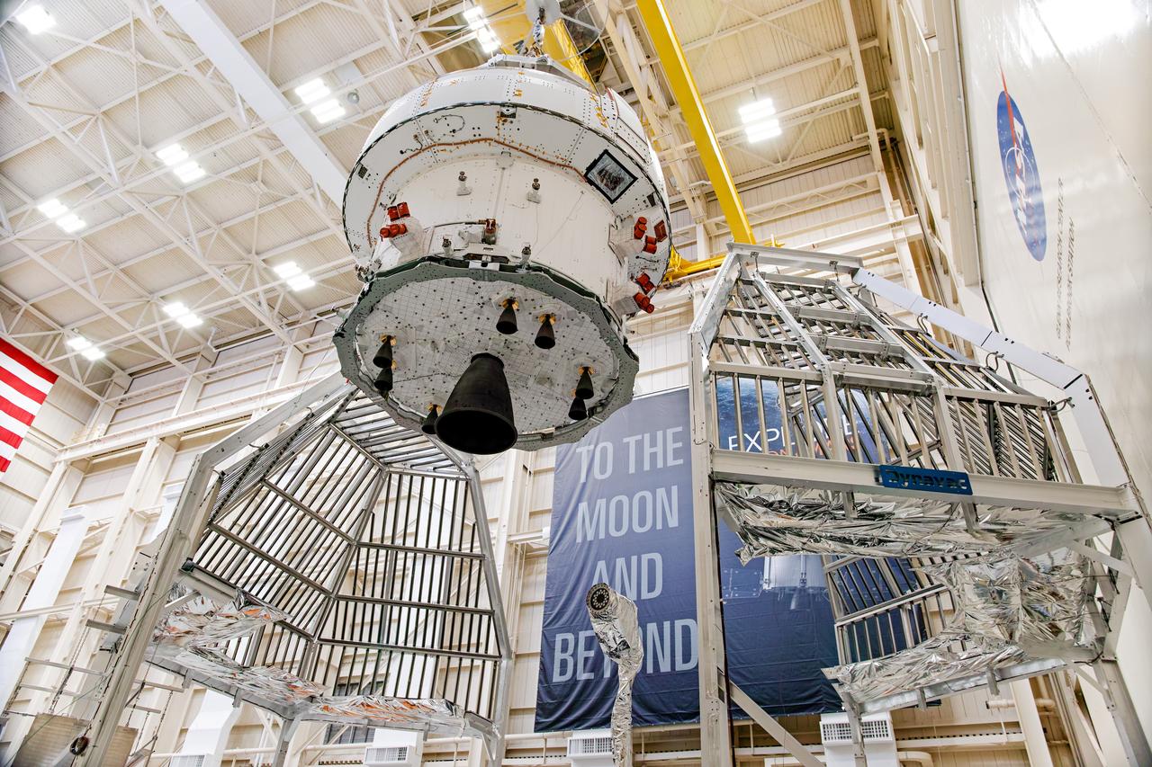 NASA’s Orion spacecraft–the crew module and European-built service module—is being lifted on Dec. 1, 2019 into a thermal cage and readied for its move into the vacuum chamber at NASA’s Neil A. Armstrong Test Facility in Ohio (formerly Plum Brook Station) for testing. Testing begins with a 60-day thermal test, where the spacecraft will be subjected to temperatures ranging from -250 to 300-degrees Fahrenheit to ensure it can withstand the harsh environment of space during Artemis missions. These extreme temperatures simulate flying in-and-out of sunlight and shadow in space using Heat Flux, a specially-designed system that heats specific parts of the spacecraft at any given time. Orion will also be surrounded on all sides by a set of large panels, called a cryogenic-shroud, that will provide the cold background temperatures of space.