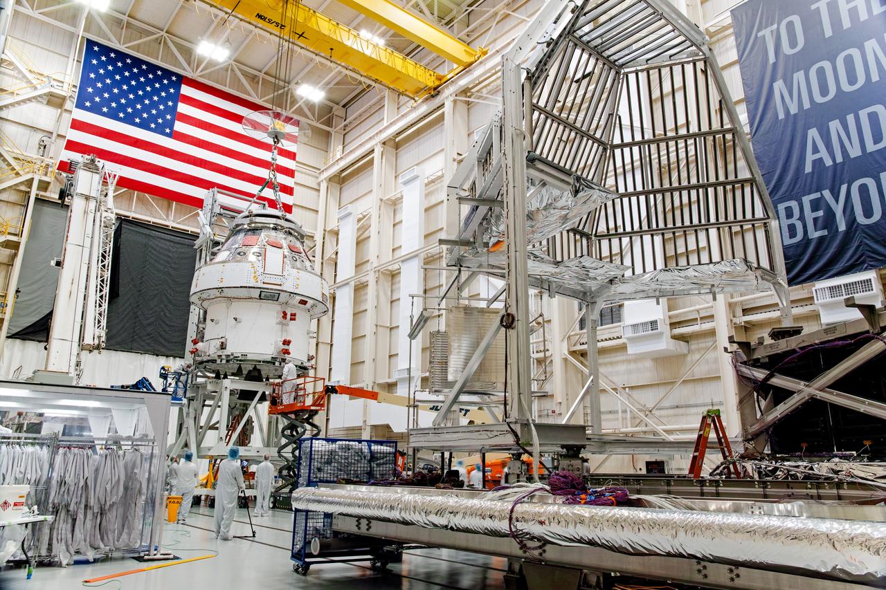 NASA’s Orion spacecraft–the crew module and European-built service module—is being lifted on Dec. 1, 2019 into a thermal cage and readied for its move into the vacuum chamber at NASA’s Neil A. Armstrong Test Facility in Ohio (formerly Plum Brook Station) for testing. Testing begins with a 60-day thermal test, where the spacecraft will be subjected to temperatures ranging from -250 to 300-degrees Fahrenheit to ensure it can withstand the harsh environment of space during Artemis missions. These extreme temperatures simulate flying in-and-out of sunlight and shadow in space using Heat Flux, a specially-designed system that heats specific parts of the spacecraft at any given time. Orion will also be surrounded on all sides by a set of large panels, called a cryogenic-shroud, that will provide the cold background temperatures of space.
