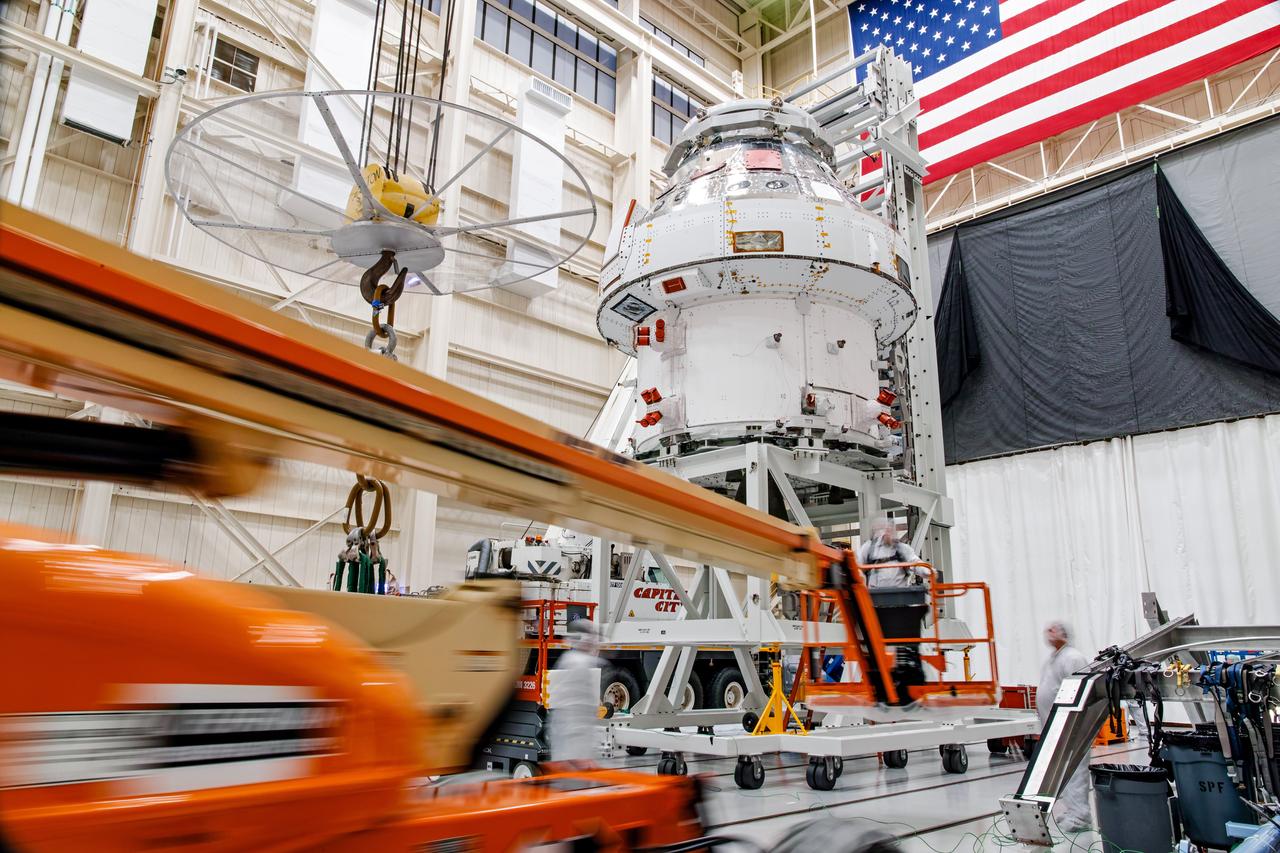 NASA’s Orion spacecraft–the crew module and European-built service module—is being lifted on Dec. 1, 2019 into a thermal cage and readied for its move into the vacuum chamber at NASA’s Neil A. Armstrong Test Facility in Ohio (formerly Plum Brook Station) for testing. Testing begins with a 60-day thermal test, where the spacecraft will be subjected to temperatures ranging from -250 to 300-degrees Fahrenheit to ensure it can withstand the harsh environment of space during Artemis missions. These extreme temperatures simulate flying in-and-out of sunlight and shadow in space using Heat Flux, a specially-designed system that heats specific parts of the spacecraft at any given time. Orion will also be surrounded on all sides by a set of large panels, called a cryogenic-shroud, that will provide the cold background temperatures of space.