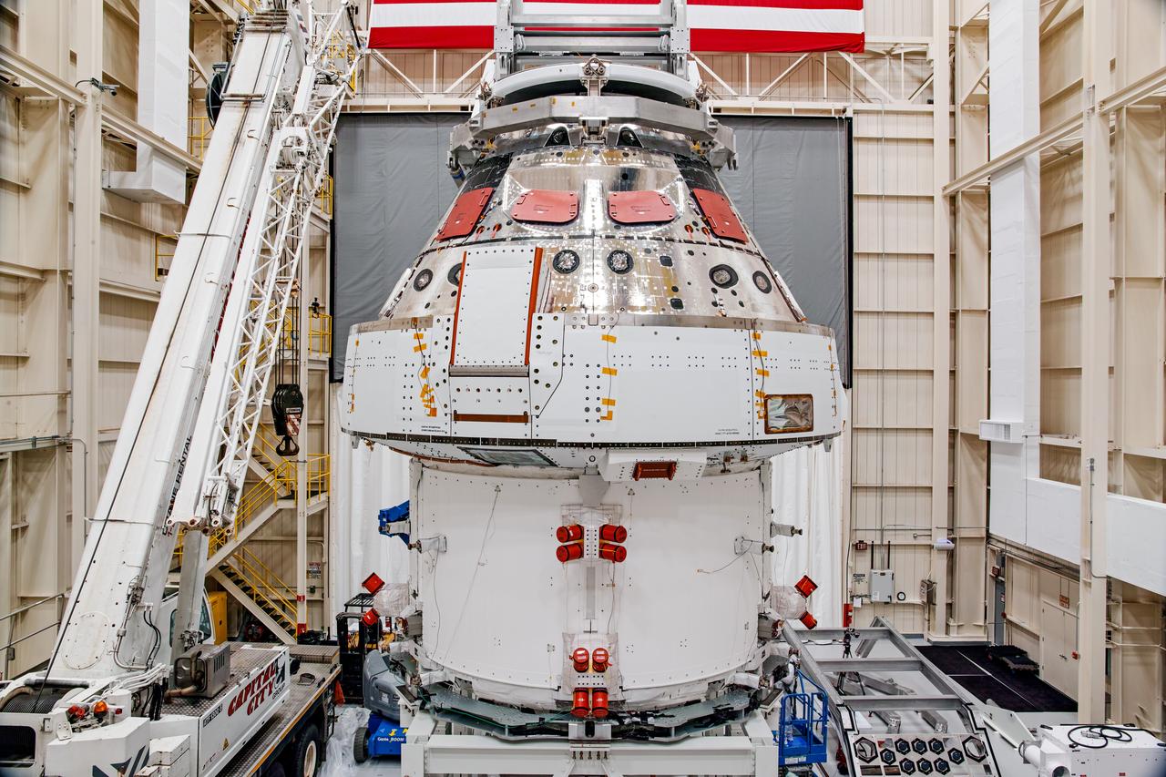 NASA’s Orion spacecraft–the crew module and European-built service module—is being lifted on Dec. 1, 2019 into a thermal cage and readied for its move into the vacuum chamber at NASA’s Neil A. Armstrong Test Facility in Ohio (formerly Plum Brook Station) for testing. Testing begins with a 60-day thermal test, where the spacecraft will be subjected to temperatures ranging from -250 to 300-degrees Fahrenheit to ensure it can withstand the harsh environment of space during Artemis missions. These extreme temperatures simulate flying in-and-out of sunlight and shadow in space using Heat Flux, a specially-designed system that heats specific parts of the spacecraft at any given time. Orion will also be surrounded on all sides by a set of large panels, called a cryogenic-shroud, that will provide the cold background temperatures of space.