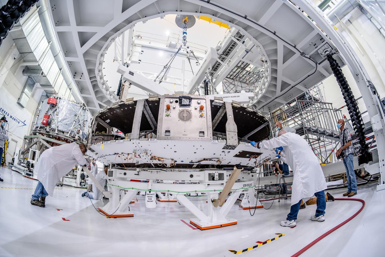 The crew module adapter, which connects Orion's crew module with the European Service Module, is lifted in preparation for mating with the Artemis II service module at Kennedy Space Center on Feb. 11, 2020.