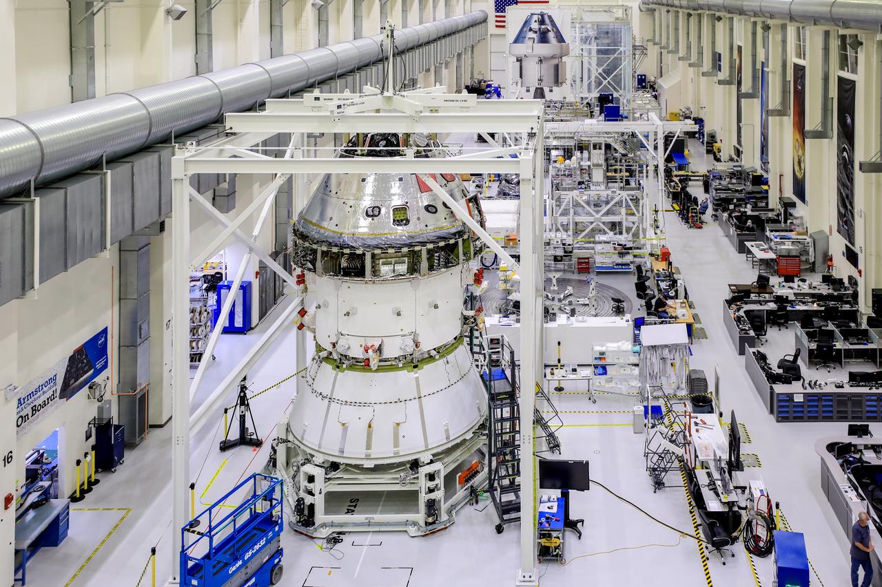 Technicians at NASA’s Kennedy Space Center in Florida are working to install an adapter that will connect the Orion spacecraft to its rocket for the Artemis I mission around the Moon. This is one of the final major hardware operations for Orion inside the Neil Armstrong Operations and Checkout Building prior to integration with the Space Launch System (SLS) rocket...The spacecraft adapter cone (seen at the bottom of the stack pictured above) connects to the bottom of Orion’s service module and will later join another adapter connected to the top of the rocket’s interim cryogenic propulsion stage (ICPS). During the process to install the cone on Orion, the spacecraft is lifted out of the Final Assembly and Systems Testing, or FAST, cell and placed into the Super Station support fixture...During flight, the SLS rocket separates in multiple stages as it pushes Orion into deep space. After accelerating Orion towards the Moon, the spacecraft will separate from the ICPS and adapter cone using pyrotechnics and springs...Next up before stacking Orion on the rocket, technicians will install coverings to protect fluid lines and electrical components on the crew module adapter that connects Orion to the service module. Workers also will install the solar array wings that will provide Orion with power, spacecraft adapter jettison fairings that enclose the service module for launch, and the forward bay cover that protects the parachute system. ..Orion will fly on the agency’s Artemis I mission – the first in a series of increasingly complex missions to the Moon that will lead to human exploration of Mars. Through the Artemis program, NASA is working to land the first woman and the next man on the Moon by 2024