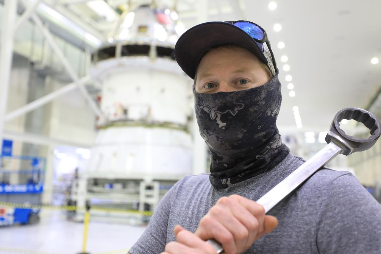 ASRC technician Chris Slack assists with the installation of the spacecraft adapter (SA) cone to the Artemis I Orion spacecraft inside the Neil Armstrong Operations and Checkout Building at NASA’s Kennedy Space Center on Aug. 10, 2020. This is one of the final major hardware operations the spacecraft will undergo during closeout processing prior to being integrated with the Space Launch System (SLS) rocket in preparation for the first Artemis mission. The spacecraft adapter cone connects the bottom portion of Orion’s service module to the top part of the rocket known as the interim cryogenic propulsion stage (ICPS). Orion will fly on the agency’s Artemis I mission – the first in a series of increasingly complex missions to the Moon that will ultimately lead to the exploration of Mars.