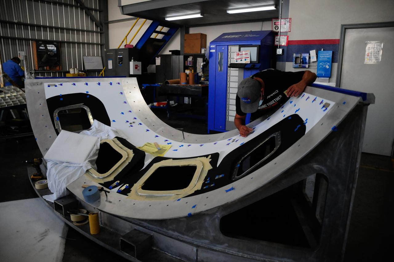 The first element machined for the Artemis III Orion crew module – a cone panel with openings for windows, designed by Orion’s lead contractor, Lockheed Martin, and manufactured by AMRO Fabricating Corp., of South El Monte, California, is shown here on Aug. 14, 2020. The completed panel is on its way to NASA’s Michoud Assembly Facility near New Orleans, Louisiana, where engineers will weld it with other panels as part of Orion’s pressure vessel.