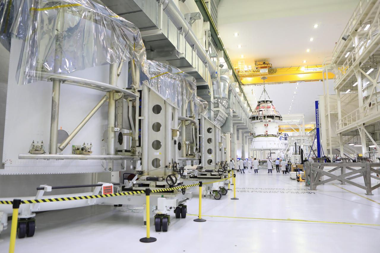 The Artemis I Orion spacecraft with its spacecraft adapter cone attached, is moved by crane along the high bay inside the Neil Armstrong Operations and Checkout Building at NASA’s Kennedy Space Center in Florida on Aug. 20, 2020. This is one of the final major hardware operations the spacecraft will undergo during closeout processing prior to being integrated with the Space Launch System (SLS) rocket in preparation for the first Artemis mission. The spacecraft adapter cone connects the bottom portion of Orion’s service module to the top part of the rocket known as the interim cryogenic propulsion stage (ICPS). Orion will fly on the agency’s Artemis I mission – the first in a series of increasingly complex missions to the Moon that will ultimately lead to the exploration of Mars.