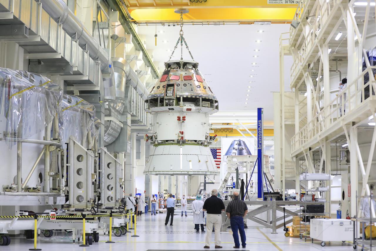 The Artemis I Orion spacecraft with its spacecraft adapter cone attached, is moved by crane along the high bay inside the Neil Armstrong Operations and Checkout Building at NASA’s Kennedy Space Center in Florida on Aug. 20, 2020. This is one of the final major hardware operations the spacecraft will undergo during closeout processing prior to being integrated with the Space Launch System (SLS) rocket in preparation for the first Artemis mission. The spacecraft adapter cone connects the bottom portion of Orion’s service module to the top part of the rocket known as the interim cryogenic propulsion stage (ICPS). Orion will fly on the agency’s Artemis I mission – the first in a series of increasingly complex missions to the Moon that will ultimately lead to the exploration of Mars.
