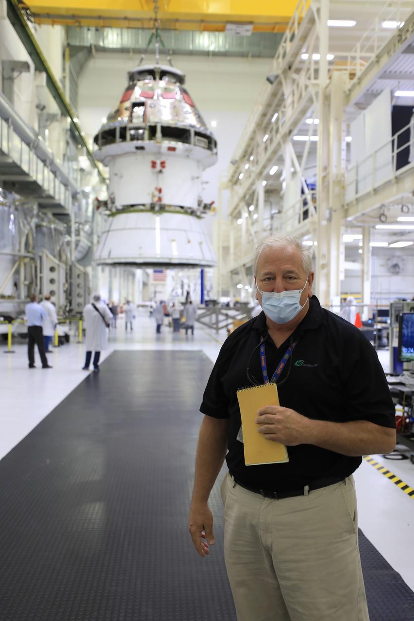 Bill Ruff, Lockheed Martin Safety manager, stands inside the Neil Armstrong Operations and Checkout Building high bay at NASA’s Kennedy Space Center in Florida on Aug. 20, 2020. Technicians are working to safely return the Artemis I Orion spacecraft to the FAST cell after completing the installation of the spacecraft adapter (SA) cone inside the high bay. This is one of the final major hardware operations the spacecraft will undergo during closeout processing prior to being integrated with the Space Launch System (SLS) rocket in preparation for the first Artemis mission. The spacecraft adapter cone connects the bottom portion of Orion’s service module to the top part of the rocket known as the interim cryogenic propulsion stage (ICPS). Orion will fly on the agency’s Artemis I mission – the first in a series of increasingly complex missions to the Moon that will ultimately lead to the exploration of Mars.