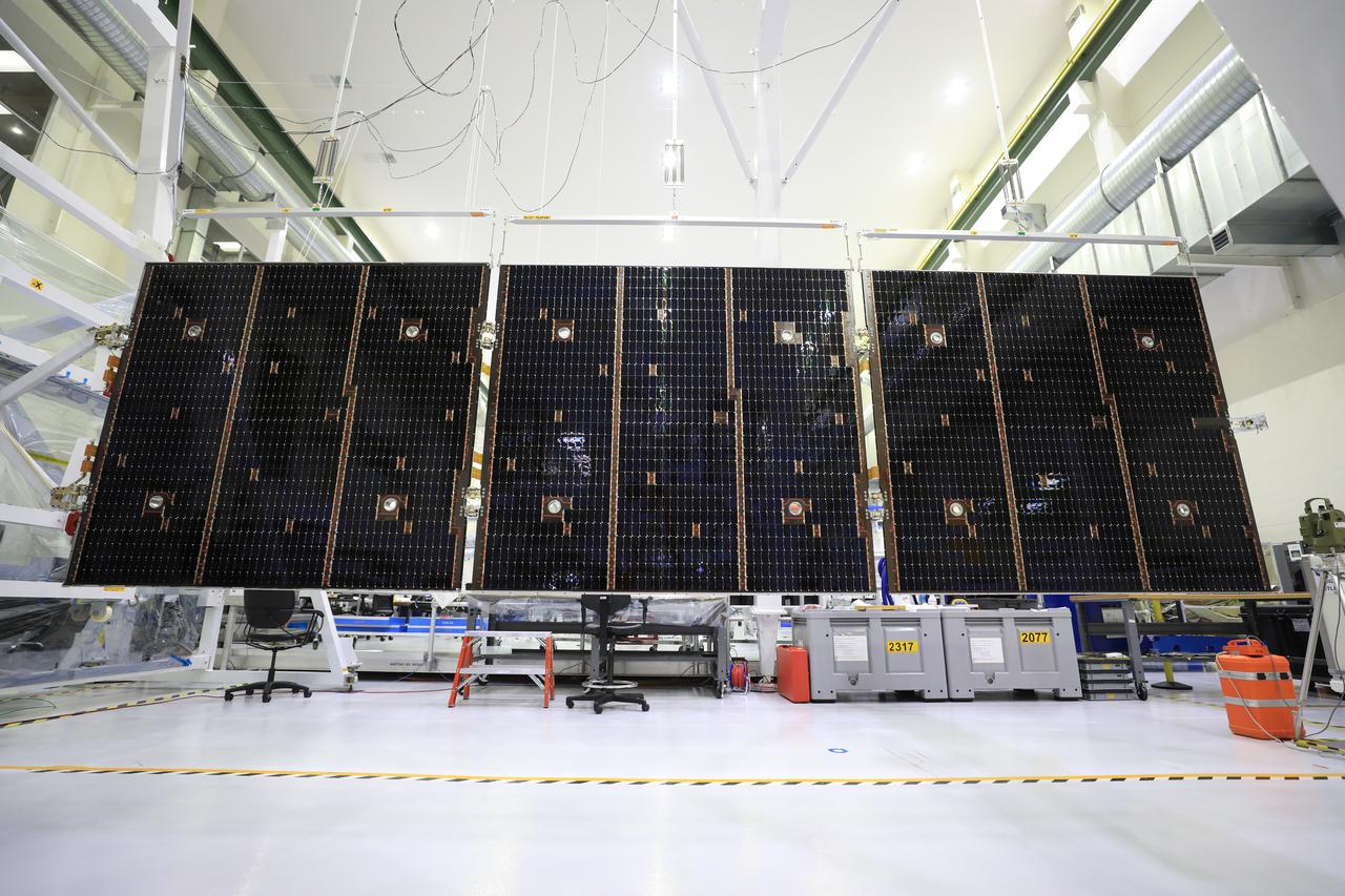 Inside the Neil Armstrong Operations and Checkout Building high bay at NASA’s Kennedy Space Center in Florida, in preparation for installation on the Artemis I spacecraft, technicians have extended one of the Artemis I solar array wings for inspection on Sept. 10, 2020, to confirm that it unfurled properly and all of the mechanisms functioned as expected. The solar array is one of four panels that will generate 11 kilowatts of power and span about 63 feet. The array is a component of Orion’s service module, which is provided by the European Space Agency and built by Airbus Defence and Space to supply Orion’s power, propulsion, air and water. The first in a series of increasingly complex missions, Artemis I will test the Orion spacecraft and Space Launch System as an integrated system ahead of crewed flights to the Moon.