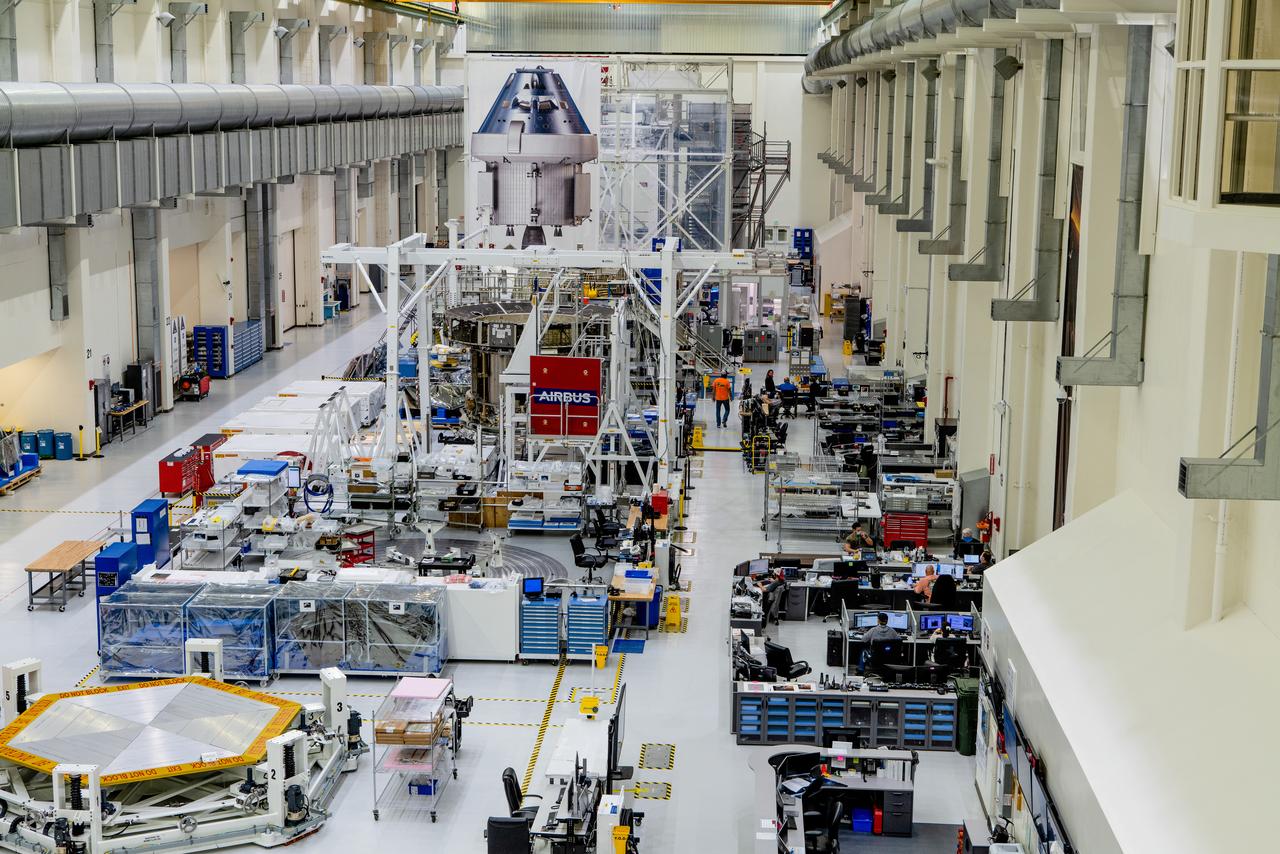 In the Operations and Checkout Building (O&amp;C) at Kennedy Space Center, three spacecraft adapter jettison (SAJ) fairings are prepared for installation and will be moved into place by technicians with Lockheed Martin, lead contractor for Orion on Oct. 12, 2020. They will be secured around the spacecraft, encapsulating the European Service Module to protect it from the harsh environment as the spacecraft is propelled out of Earth’s atmosphere atop the Space Launch System (SLS) rocket during NASA’s Artemis I mission. The next time the solar array wings will be visible will be when Orion is in space. Artemis I will test the Orion spacecraft and SLS as an integrated system ahead of crewed flights to the Moon.