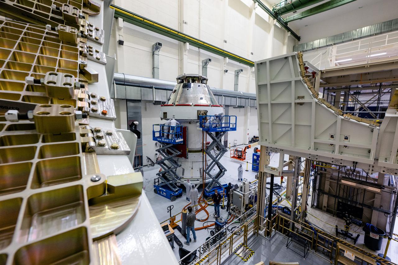 In the Operations and Checkout Building (O&amp;C) at Kennedy Space Center, three spacecraft adapter jettison (SAJ) fairings are prepared for installation and will be moved into place by technicians with Lockheed Martin, lead contractor for Orion on Oct. 12, 2020. They will be secured around the spacecraft, encapsulating the European Service Module to protect it from the harsh environment as the spacecraft is propelled out of Earth’s atmosphere atop the Space Launch System (SLS) rocket during NASA’s Artemis I mission. The next time the solar array wings will be visible will be when Orion is in space. Artemis I will test the Orion spacecraft and SLS as an integrated system ahead of crewed flights to the Moon.