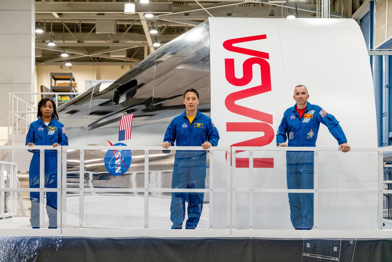 NASA Astronauts Stephanie Wilson, Jonny Kim, and Randy Bresnik take a look at the Orion spacecraft simulator that recently arrived at the agency’s Johnson Space Center in Houston on Dec. 8, 2020. The simulator provides the ability for astronauts, engineers, and flight controllers to train and practice for scenarios during Artemis missions to the Moon. The interior of the simulator is being outfitted with Orion’s display and control system and crew seats to mimic what astronaut will experience during liftoff to the lunar vicinity and on their way back home to Earth...Kim and Wilson are among the 18 astronauts recently named to the Artemis Team of astronauts eligible to be selected for Artemis missions to the Moon. Bresnik is currently the assistant to the chief of the astronaut office for exploration. NASA is targeting 2023 for Artemis II, the first mission with crew, with the Orion Spacecraft set to launch atop the agency’s Space Launch System rocket. The mission will send astronauts around the Moon and return them back to Earth, a flight that will set the stage for the first woman and next man to step foot on the Moon.