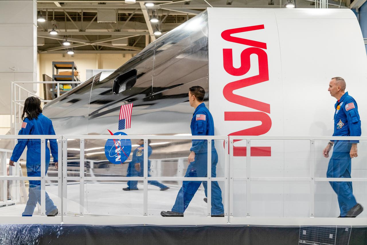 NASA Astronauts Stephanie Wilson, Jonny Kim, and Randy Bresnik take a look at the Orion spacecraft simulator that recently arrived at the agency’s Johnson Space Center in Houston on Dec. 8, 2020. The simulator provides the ability for astronauts, engineers, and flight controllers to train and practice for scenarios during Artemis missions to the Moon. The interior of the simulator is being outfitted with Orion’s display and control system and crew seats to mimic what astronaut will experience during liftoff to the lunar vicinity and on their way back home to Earth...Kim and Wilson are among the 18 astronauts recently named to the Artemis Team of astronauts eligible to be selected for Artemis missions to the Moon. Bresnik is currently the assistant to the chief of the astronaut office for exploration. NASA is targeting 2023 for Artemis II, the first mission with crew, with the Orion Spacecraft set to launch atop the agency’s Space Launch System rocket. The mission will send astronauts around the Moon and return them back to Earth, a flight that will set the stage for the first woman and next man to step foot on the Moon.