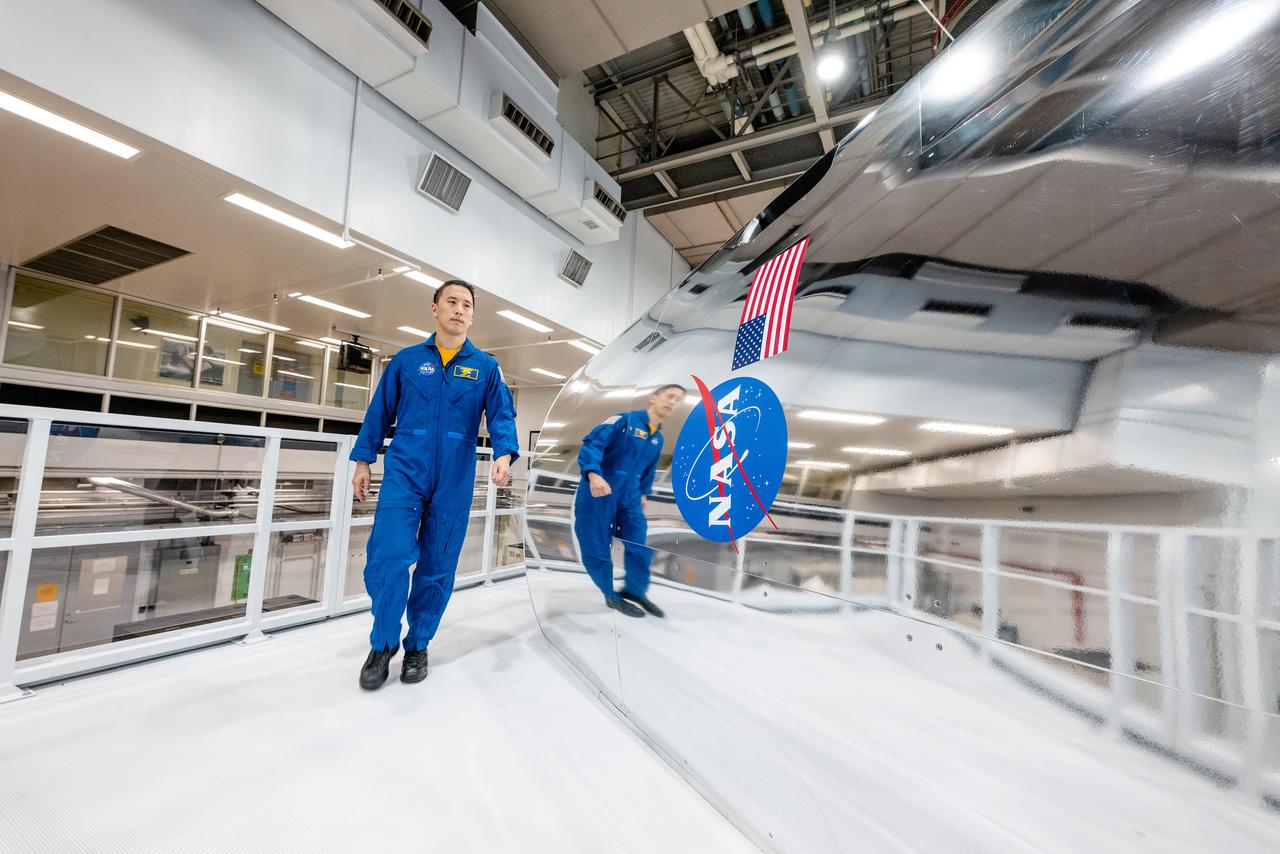 NASA Astronauts Stephanie Wilson, Jonny Kim, and Randy Bresnik take a look at the Orion spacecraft simulator that recently arrived at the agency’s Johnson Space Center in Houston on Dec. 8, 2020. The simulator provides the ability for astronauts, engineers, and flight controllers to train and practice for scenarios during Artemis missions to the Moon. The interior of the simulator is being outfitted with Orion’s display and control system and crew seats to mimic what astronaut will experience during liftoff to the lunar vicinity and on their way back home to Earth...Kim and Wilson are among the 18 astronauts recently named to the Artemis Team of astronauts eligible to be selected for Artemis missions to the Moon. Bresnik is currently the assistant to the chief of the astronaut office for exploration. NASA is targeting 2023 for Artemis II, the first mission with crew, with the Orion Spacecraft set to launch atop the agency’s Space Launch System rocket. The mission will send astronauts around the Moon and return them back to Earth, a flight that will set the stage for the first woman and next man to step foot on the Moon.