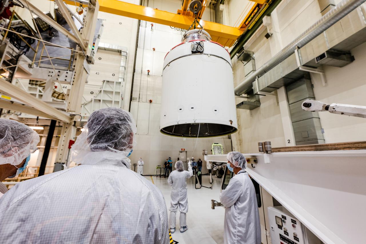 The Artemis I Orion spacecraft is moved out of the Final Assembly And Test (FAST) cell at Neil Armstrong Operations and Checkout Building at Kennedy Space Center in preparation for transport to Multi Payload Processing Facility on Jan. 14, 2021.