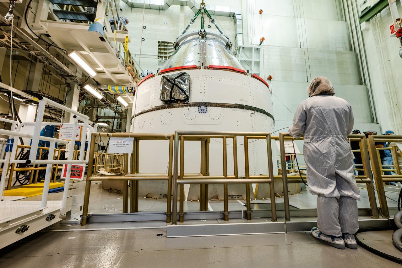 The Artemis I Orion spacecraft is moved out of the Final Assembly And Test (FAST) cell at Neil Armstrong Operations and Checkout Building at Kennedy Space Center in preparation for transport to Multi Payload Processing Facility on Jan. 14, 2021.