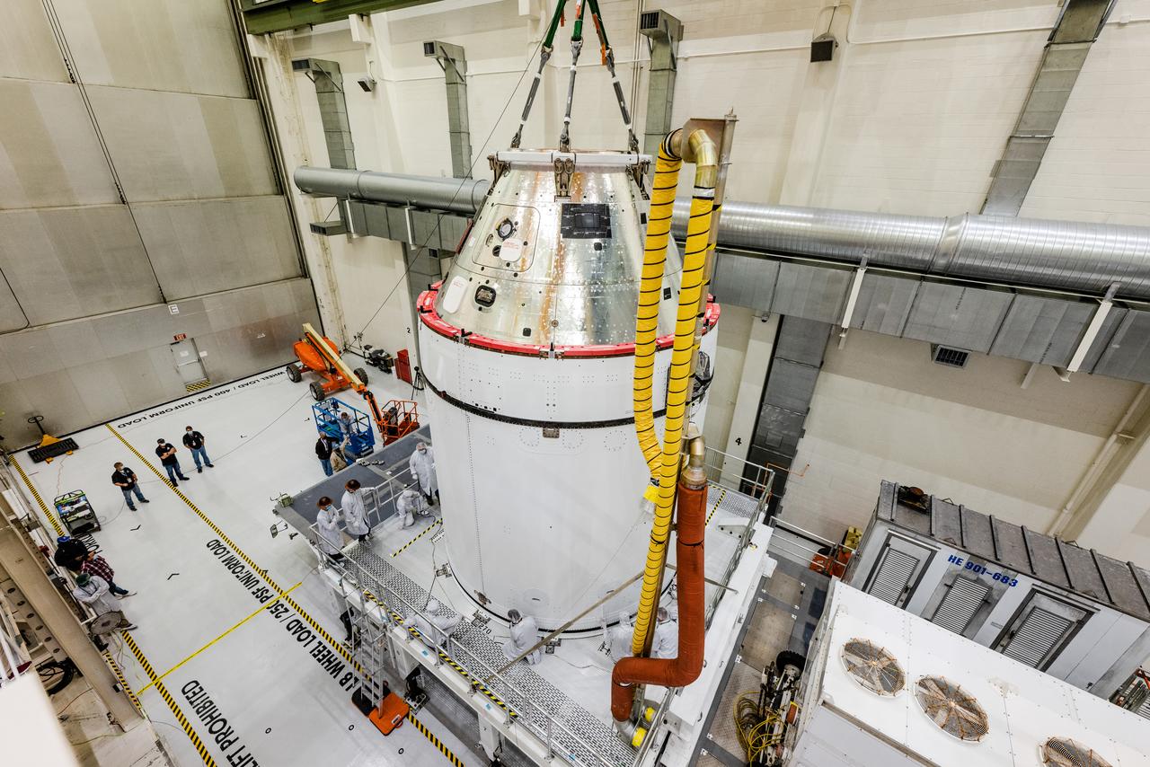 The Artemis I Orion spacecraft is moved out of the Final Assembly And Test (FAST) cell at Neil Armstrong Operations and Checkout Building at Kennedy Space Center in preparation for transport to Multi Payload Processing Facility on Jan. 14, 2021.