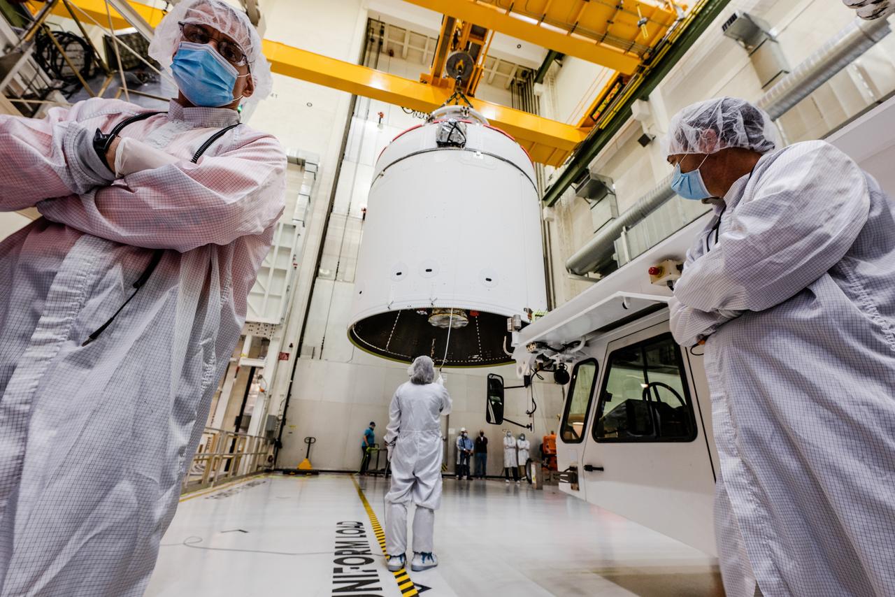 The Artemis I Orion spacecraft is moved out of the Final Assembly And Test (FAST) cell at Neil Armstrong Operations and Checkout Building at Kennedy Space Center in preparation for transport to Multi Payload Processing Facility on Jan. 14, 2021.