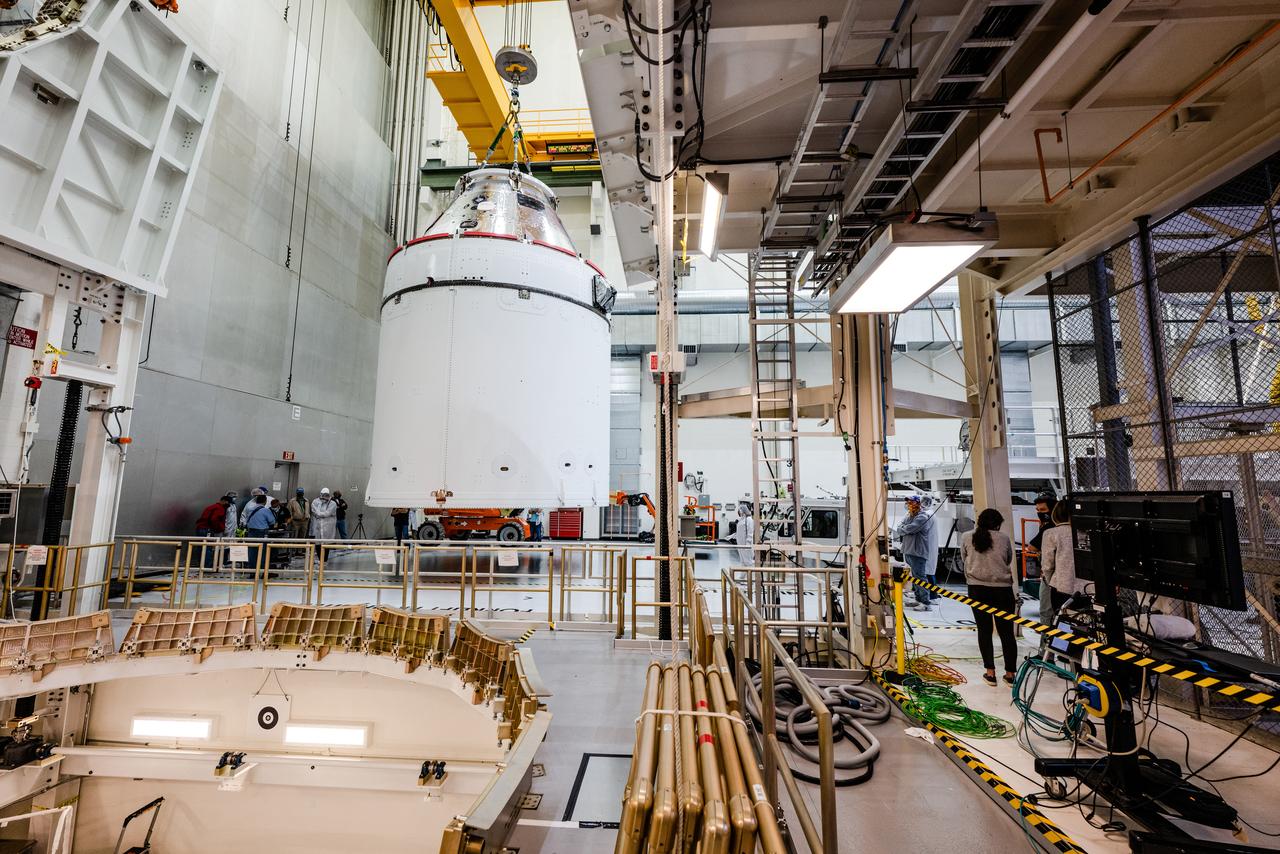 The Artemis I Orion spacecraft is moved out of the Final Assembly And Test (FAST) cell at Neil Armstrong Operations and Checkout Building at Kennedy Space Center in preparation for transport to Multi Payload Processing Facility on Jan. 14, 2021.