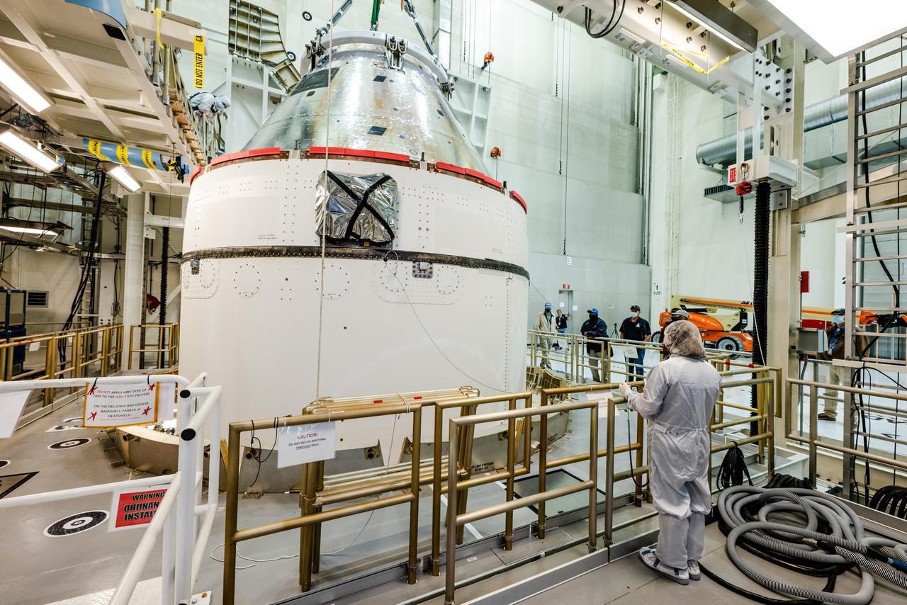 The Artemis I Orion spacecraft is moved out of the Final Assembly And Test (FAST) cell at Neil Armstrong Operations and Checkout Building at Kennedy Space Center in preparation for transport to Multi Payload Processing Facility on Jan. 14, 2021.