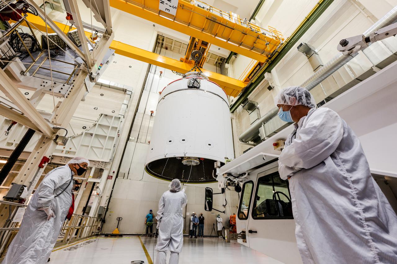 The Artemis I Orion spacecraft is moved out of the Final Assembly And Test (FAST) cell at Neil Armstrong Operations and Checkout Building at Kennedy Space Center in preparation for transport to Multi Payload Processing Facility on Jan. 14, 2021.