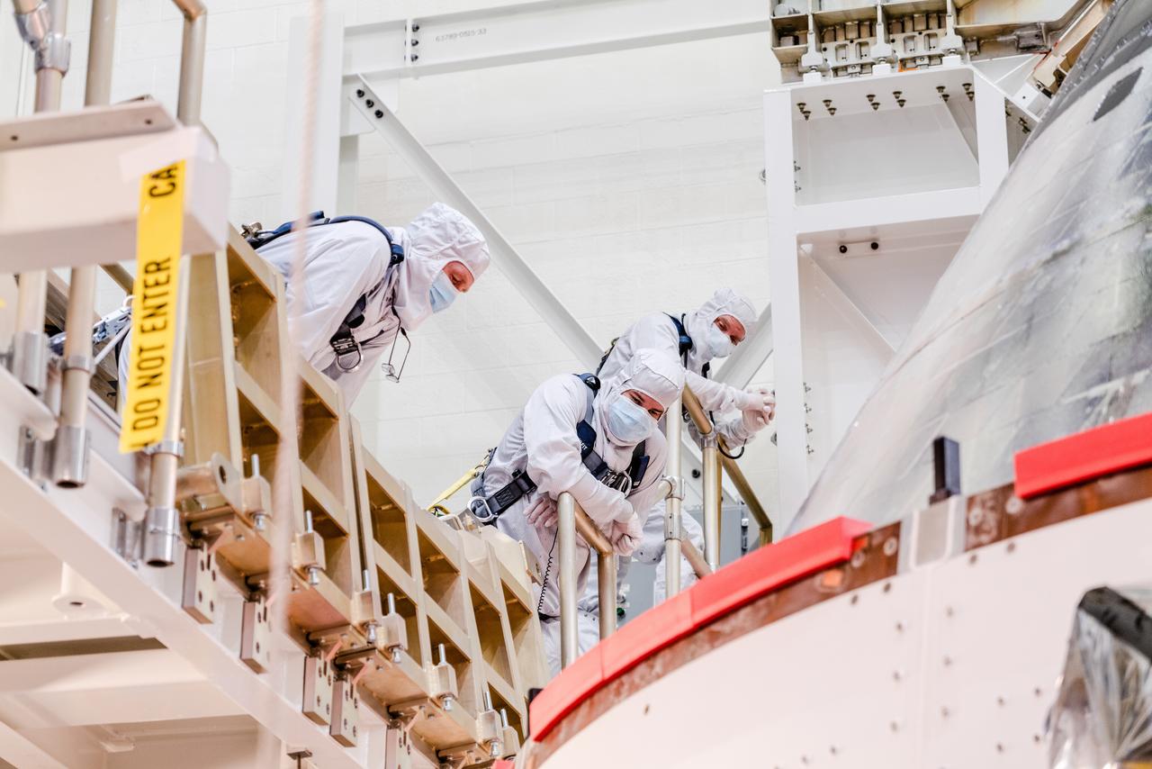 The Artemis I Orion spacecraft is moved out of the Final Assembly And Test (FAST) cell at Neil Armstrong Operations and Checkout Building at Kennedy Space Center in preparation for transport to Multi Payload Processing Facility on Jan. 14, 2021.