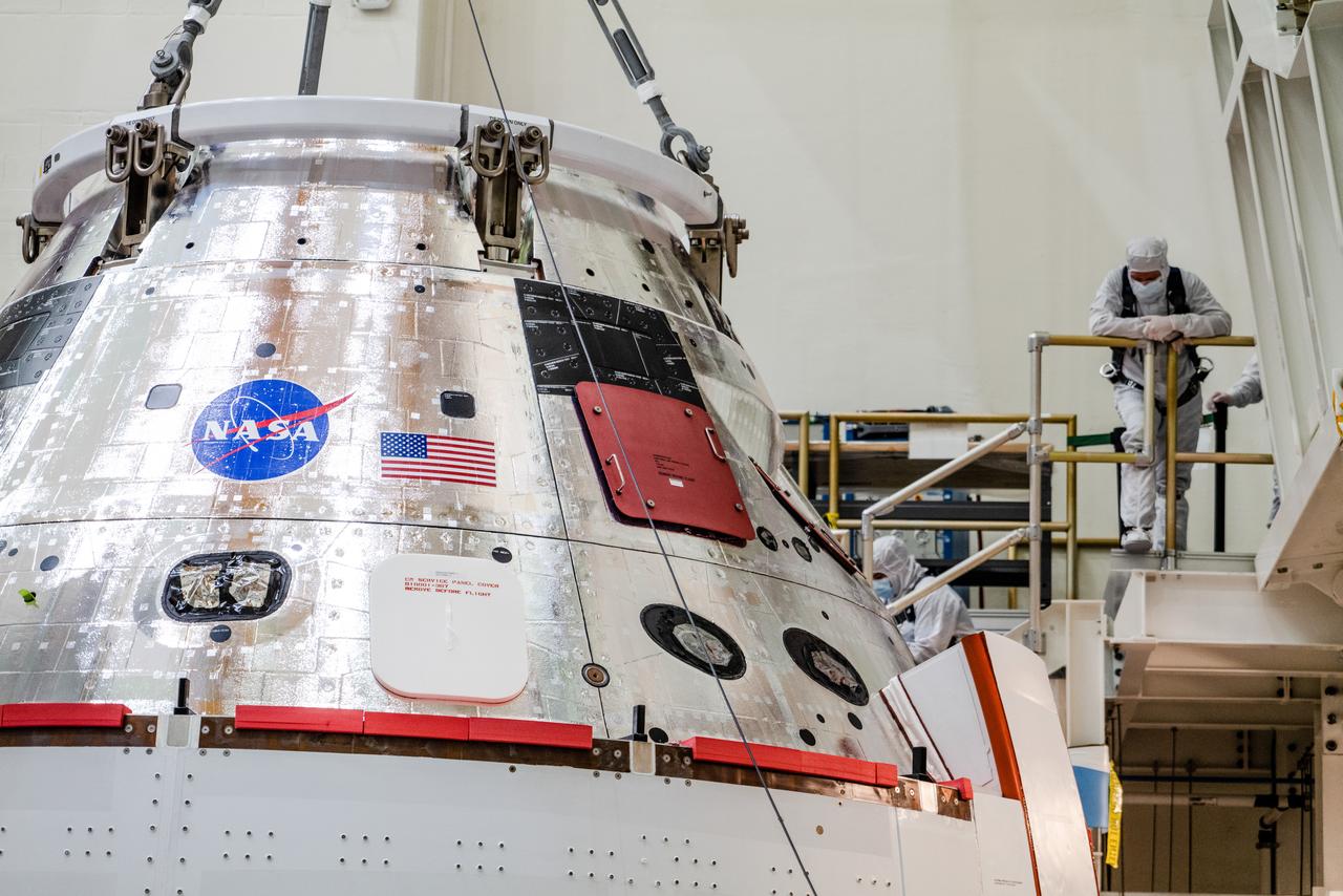 The Artemis I Orion spacecraft is moved out of the Final Assembly And Test (FAST) cell at Neil Armstrong Operations and Checkout Building at Kennedy Space Center in preparation for transport to Multi Payload Processing Facility on Jan. 14, 2021.