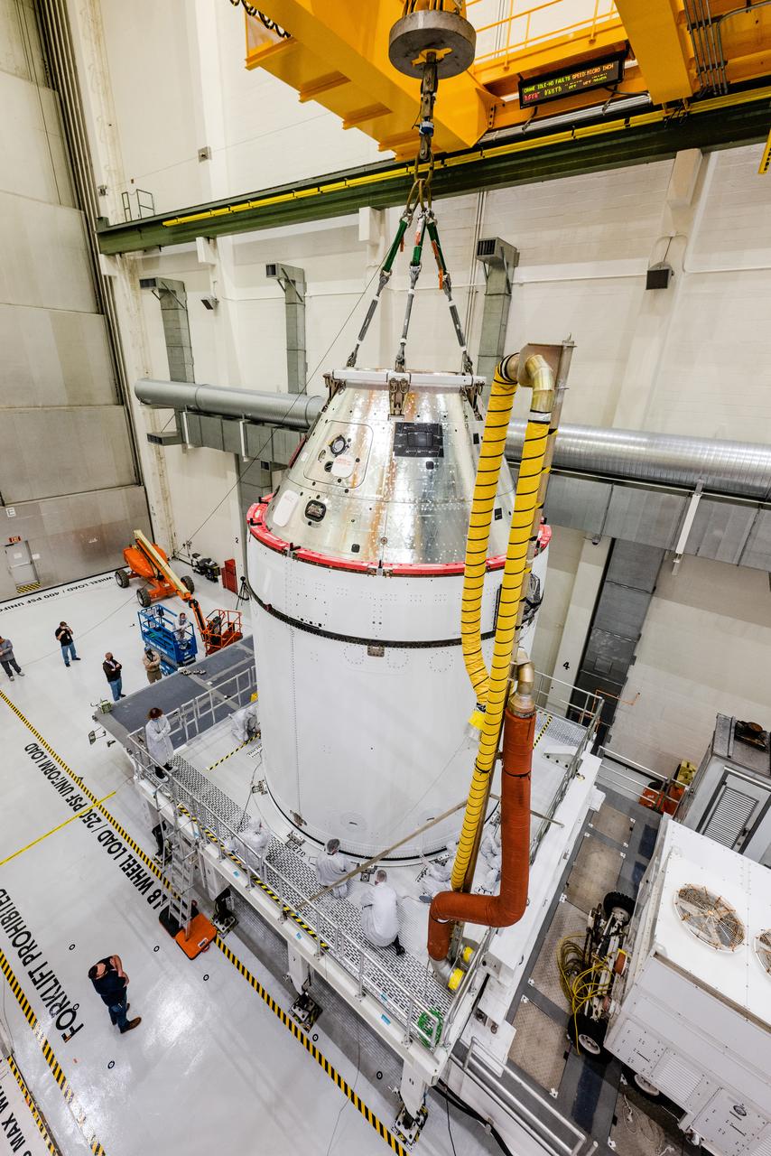 The Artemis I Orion spacecraft is moved out of the Final Assembly And Test (FAST) cell at Neil Armstrong Operations and Checkout Building at Kennedy Space Center in preparation for transport to Multi Payload Processing Facility on Jan. 14, 2021.