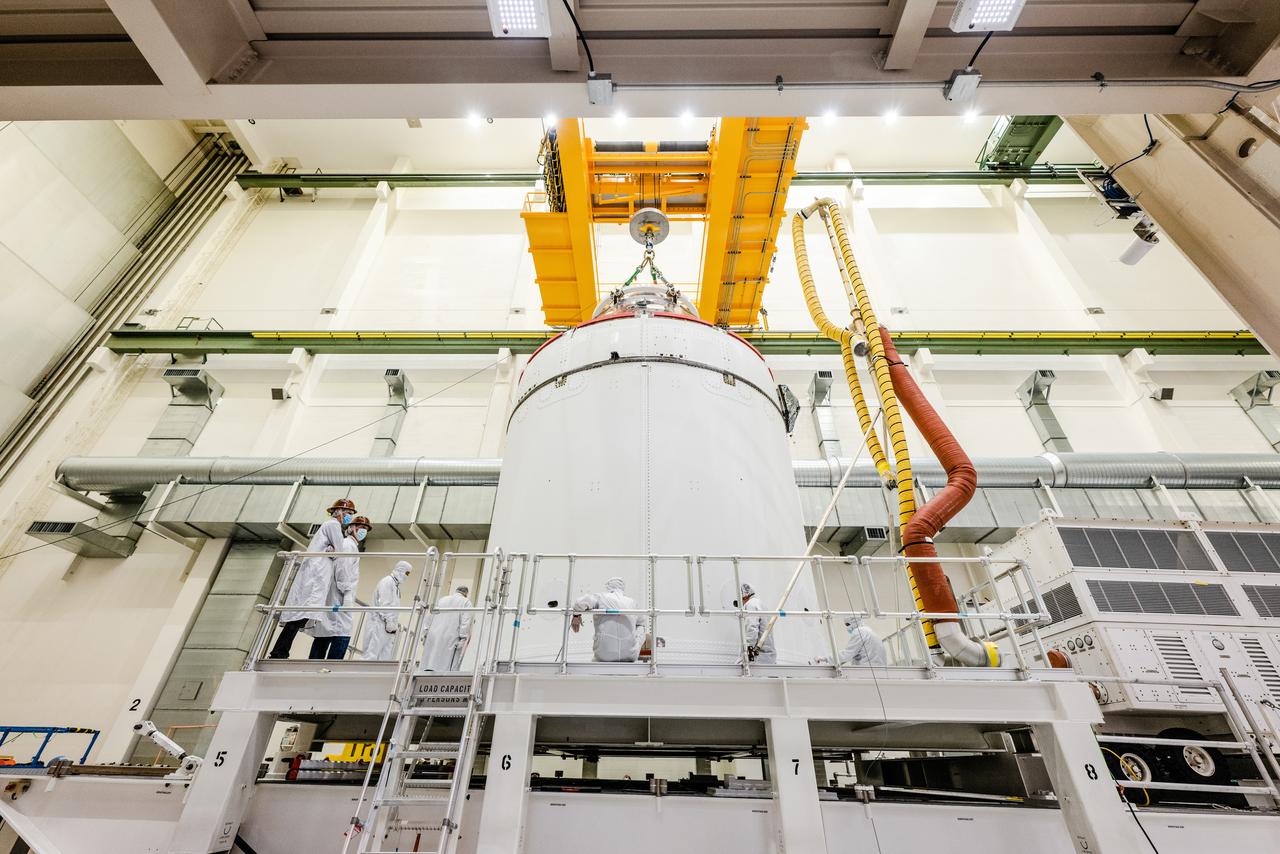 The Artemis I Orion spacecraft is moved out of the Final Assembly And Test (FAST) cell at Neil Armstrong Operations and Checkout Building at Kennedy Space Center in preparation for transport to Multi Payload Processing Facility on Jan. 14, 2021.