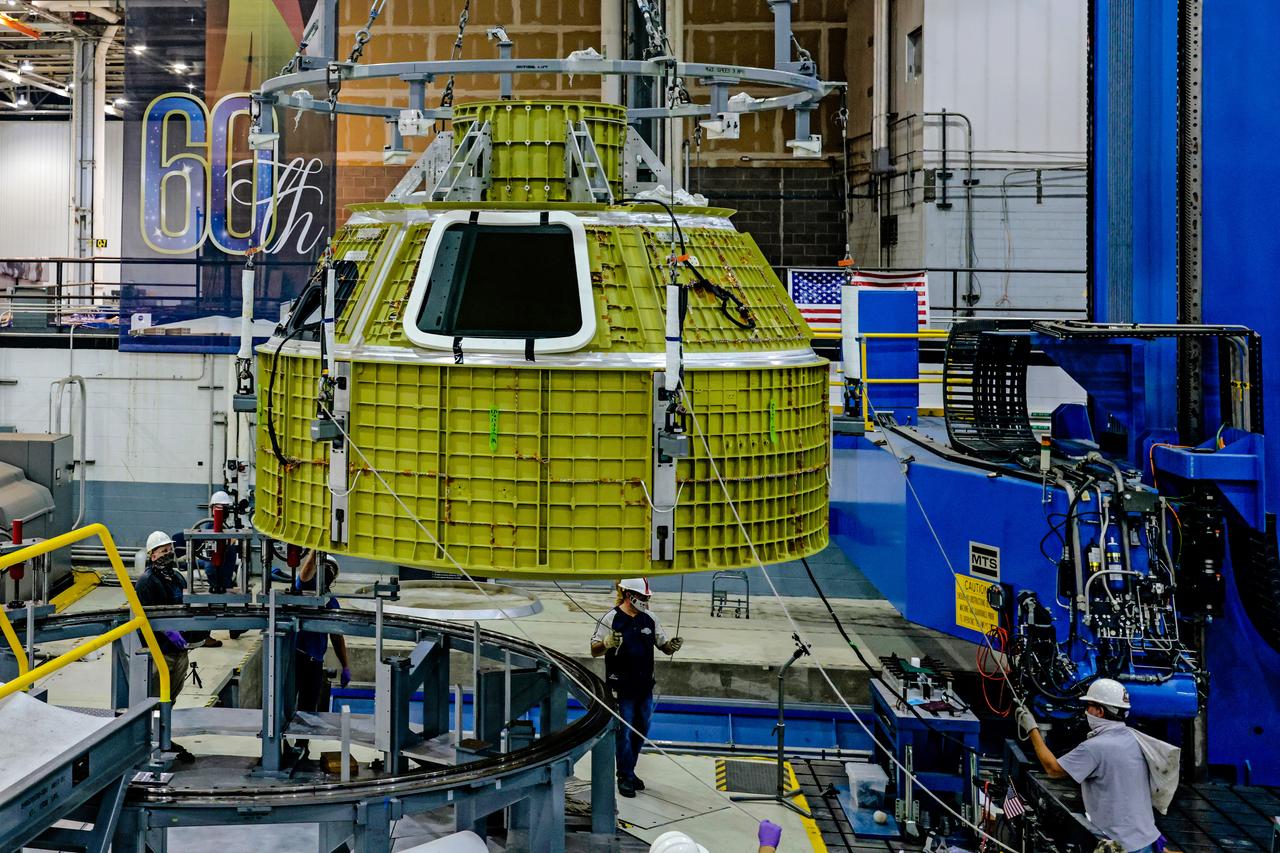 At NASA's Michoud Assembly Facility in New Orleans, Orion's newly completed pressure vessel for the Artemis III mission is lifted out of the welding tool on Aug. 27, 2021. The pressure vessel is the primary structure for Orion's crew module, joined together using state-of-the-art welding by technicians from lead contractor Lockheed Martin.